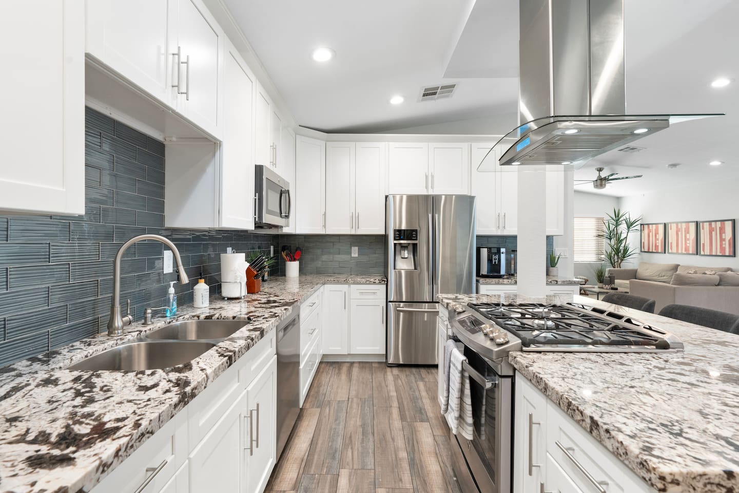Fully equipped kitchen with granite countertops, stainless steel appliances, and ample cabinet space. A perfect setting for preparing and enjoying your favorite meals.