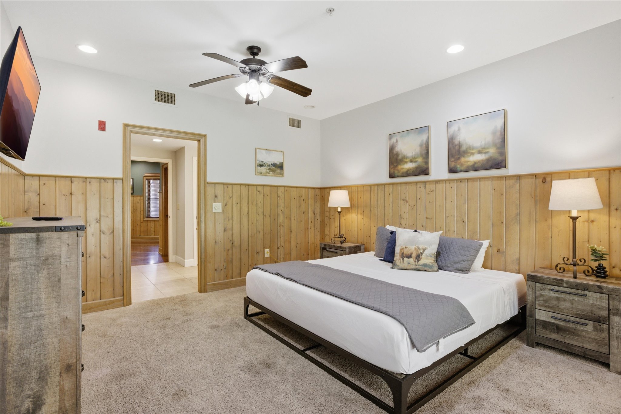 Stretch out in this spacious king bedroom with direct access to the porch, an ensuite bathroom that connects to the living space, and a TV for winding down. You’ll have plenty of storage with a closet and dresser to settle in comfortably.