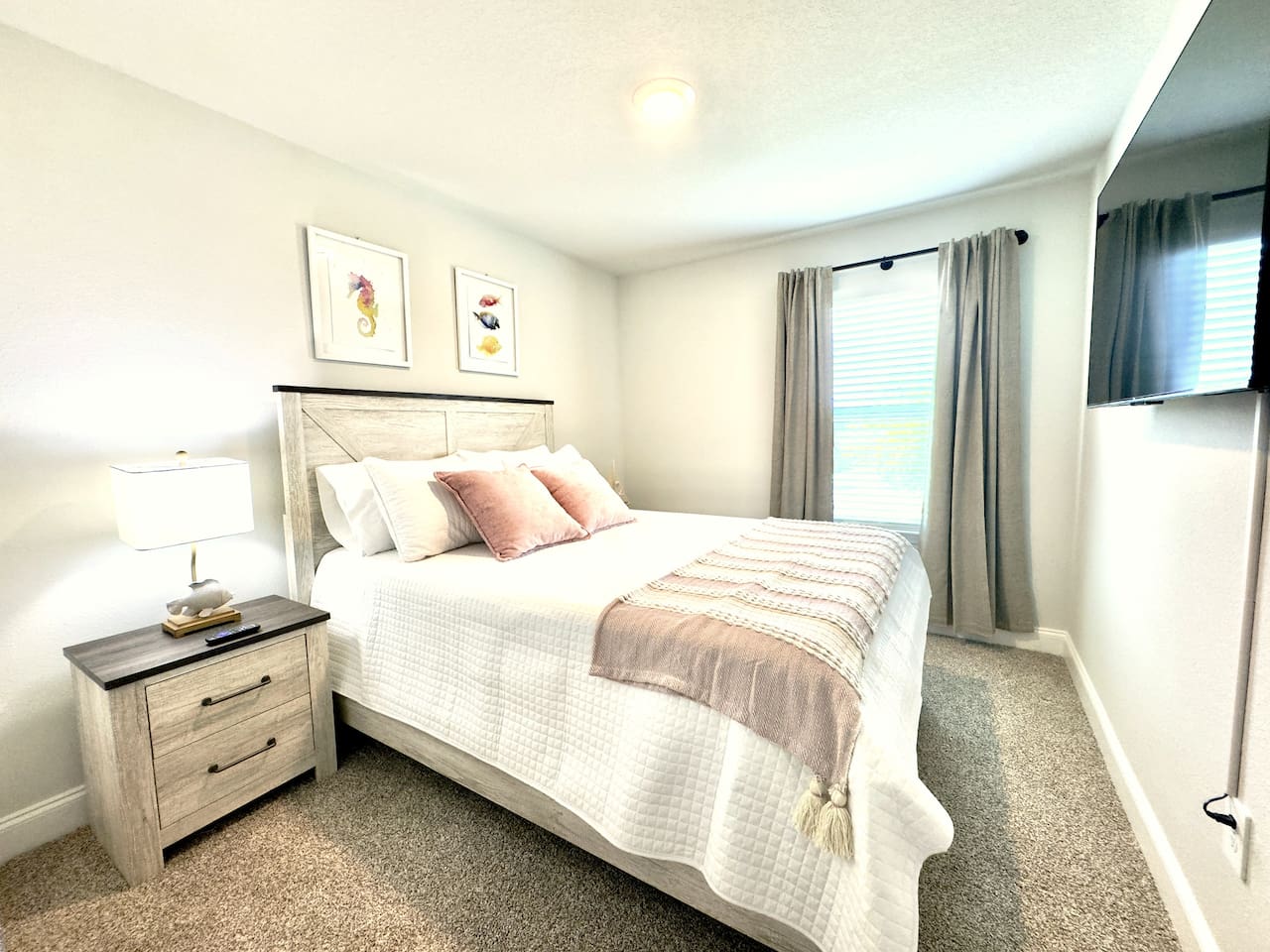 Exhausted, you sink into this bed — plush white linens, soft accent pillows cradling you, plush carpet beneath tired feet. Through the sheer curtains, soft daylight glows gently. Quiet, cocooned, ready to rest.