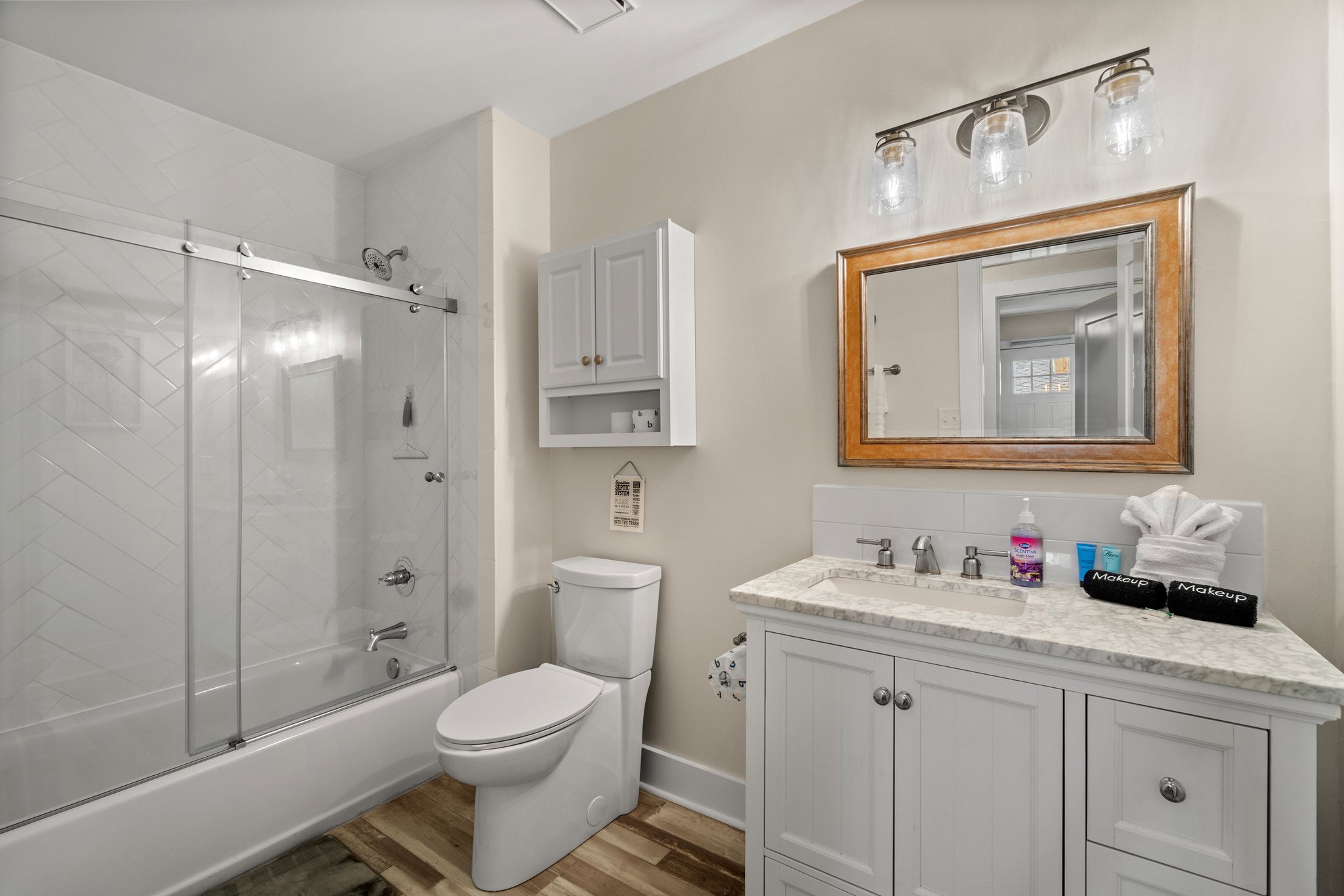 The beach house hall bathroom has everything you need with some coastal vibes. #beachvibes