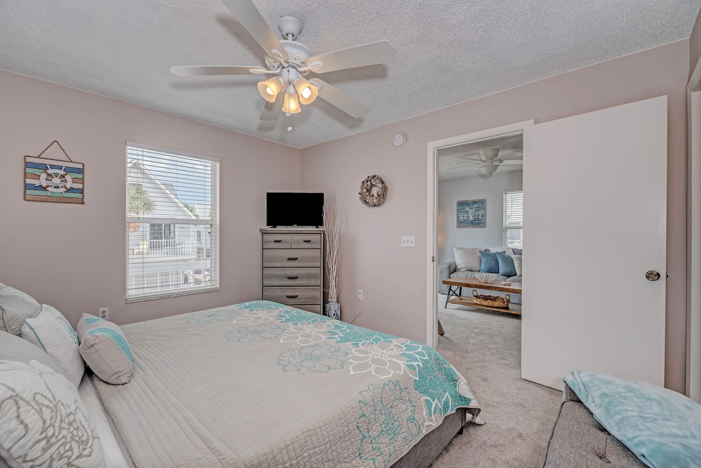 Primary bedroom with attached full bath and walk in closet. Enjoy a restful night on our king bed with lux mattress (a Purple mattress!). 