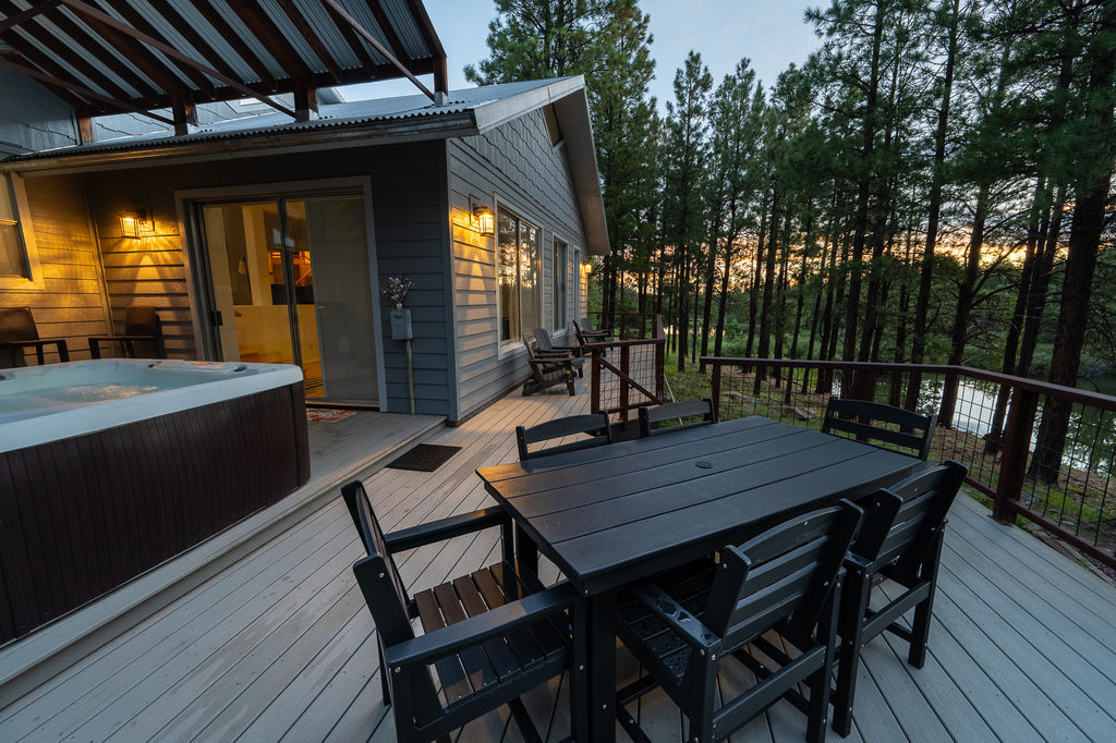Expansive wrap around deck with outdoor dining and sitting. 