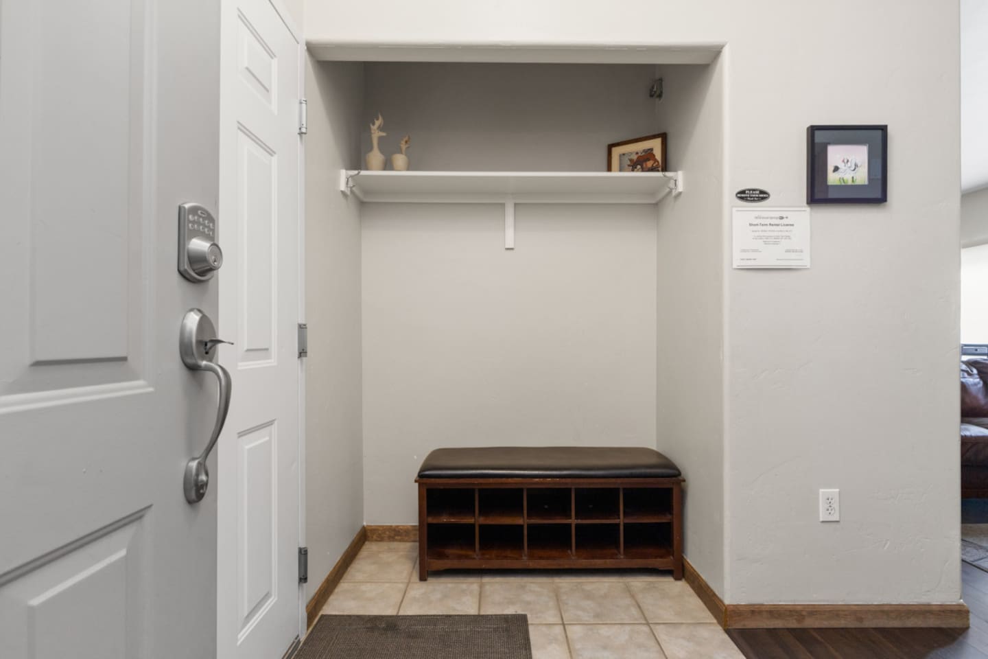 Entryway with Door to Garage on Left