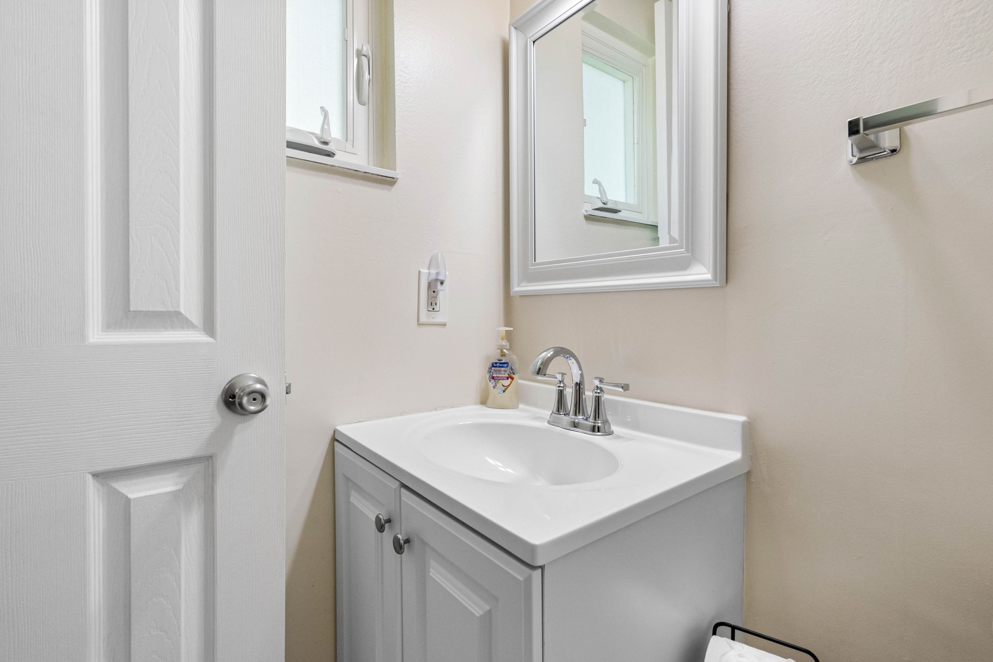 The bright lighting provides great visibility for grooming, while the fresh white palette keeps the space feeling airy and open.