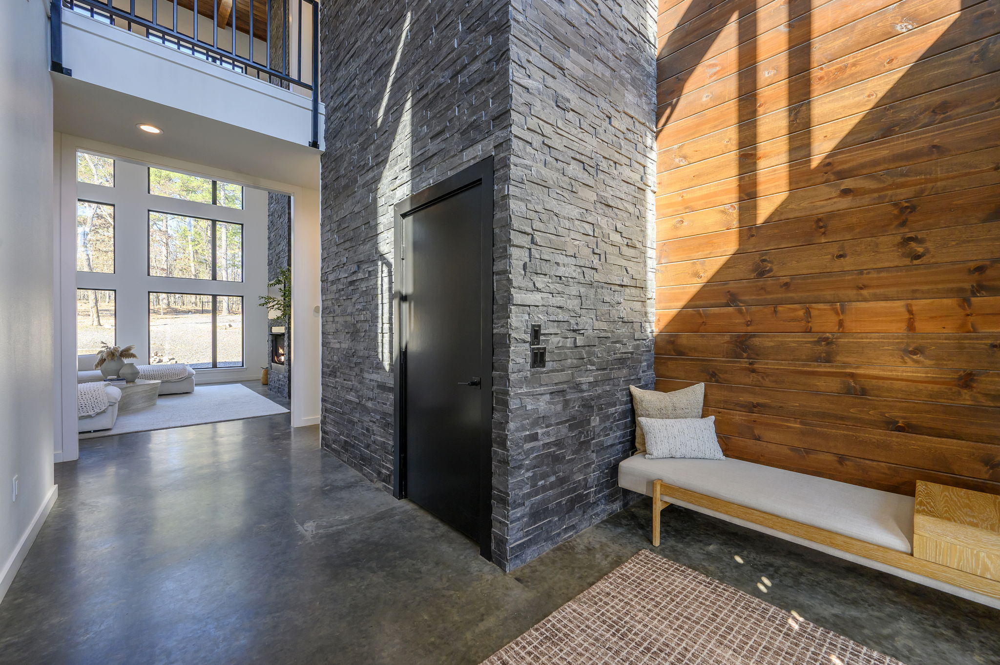 Main entrance to cabin, featuring a towering marble accent wall.