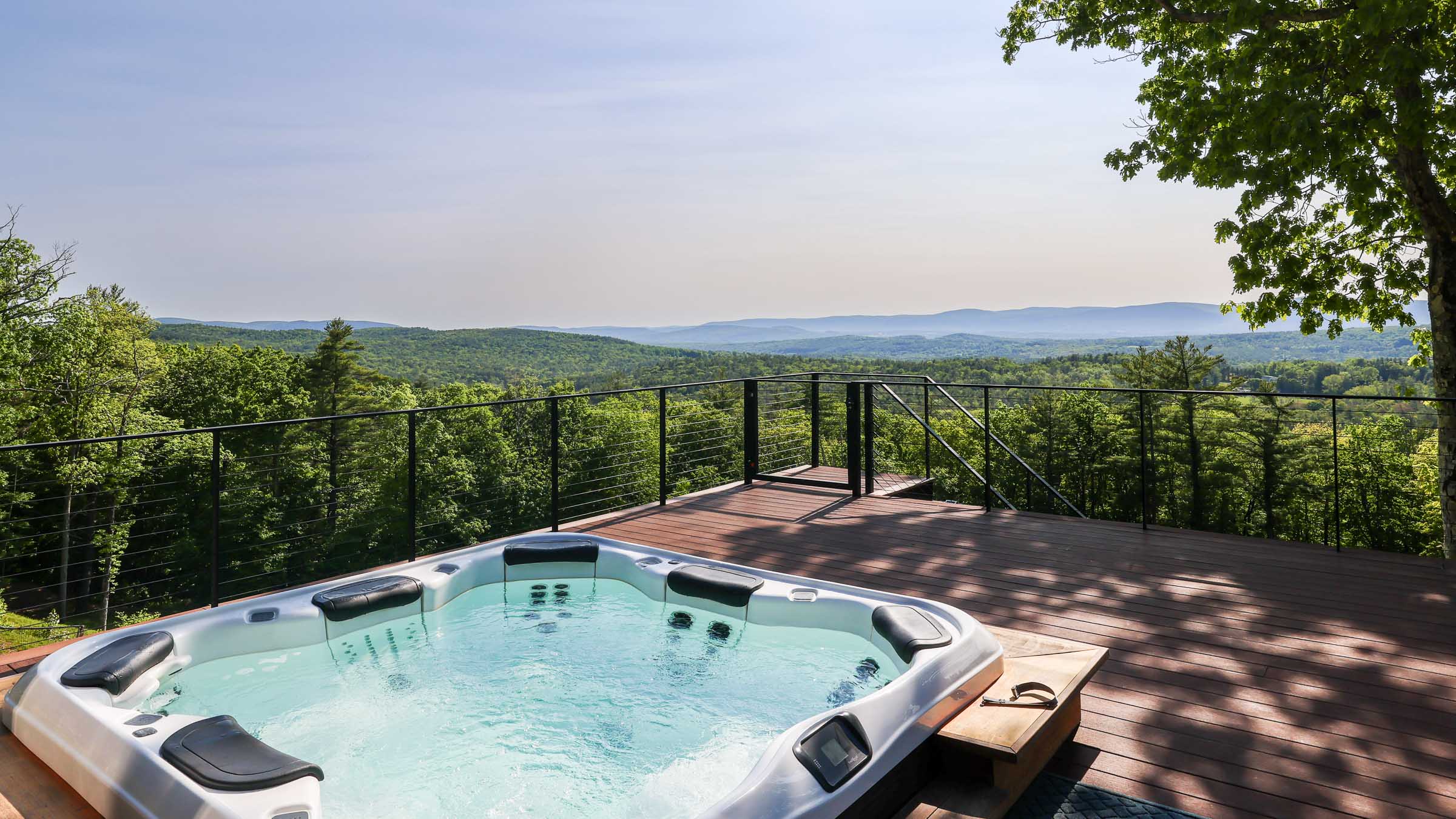 Sunset Falls Restore hot tub deck with sunset ridgeline view summer Berkshires