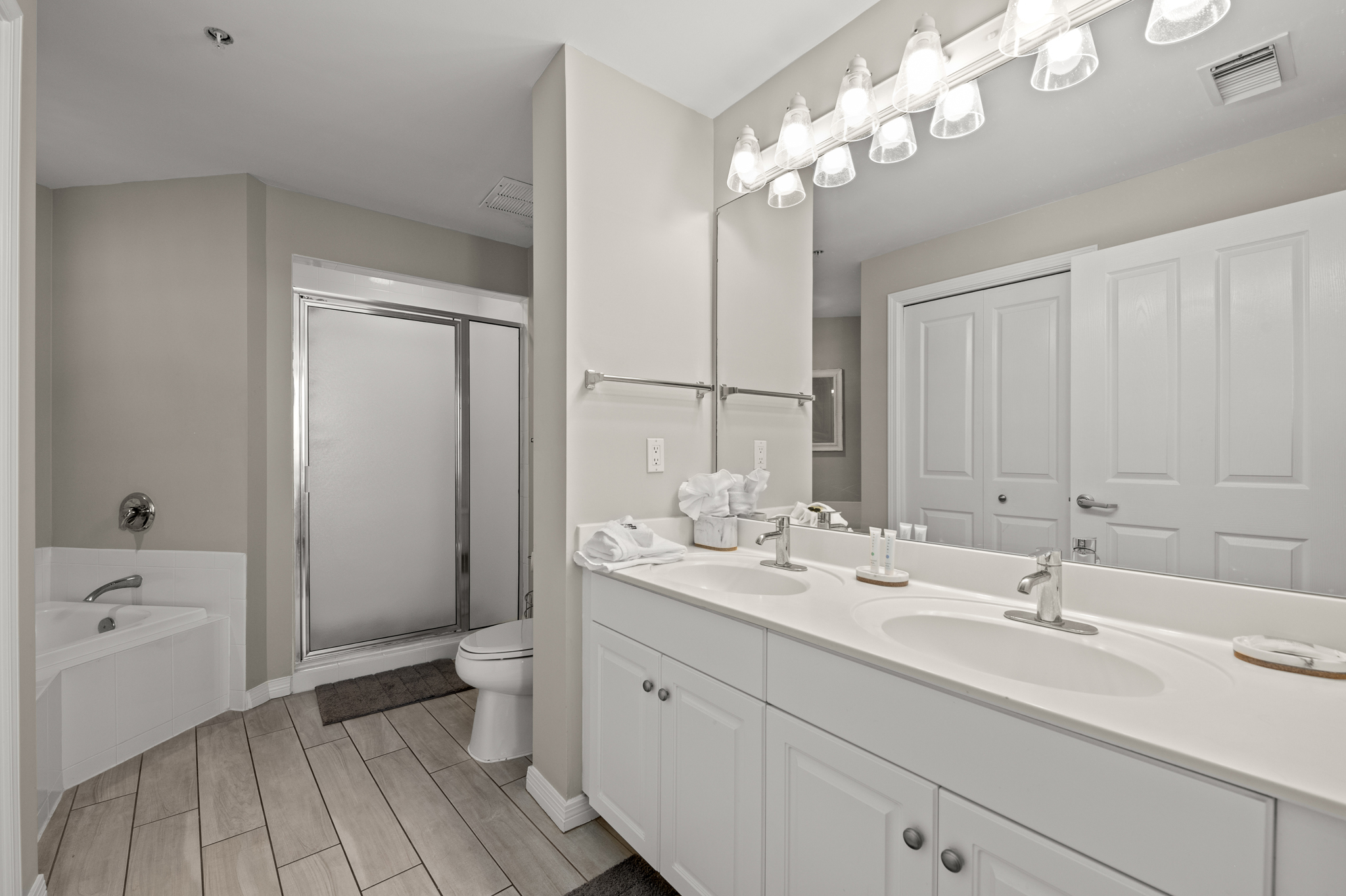 Bathroom w/ dual sinks, offering extra space for getting ready.