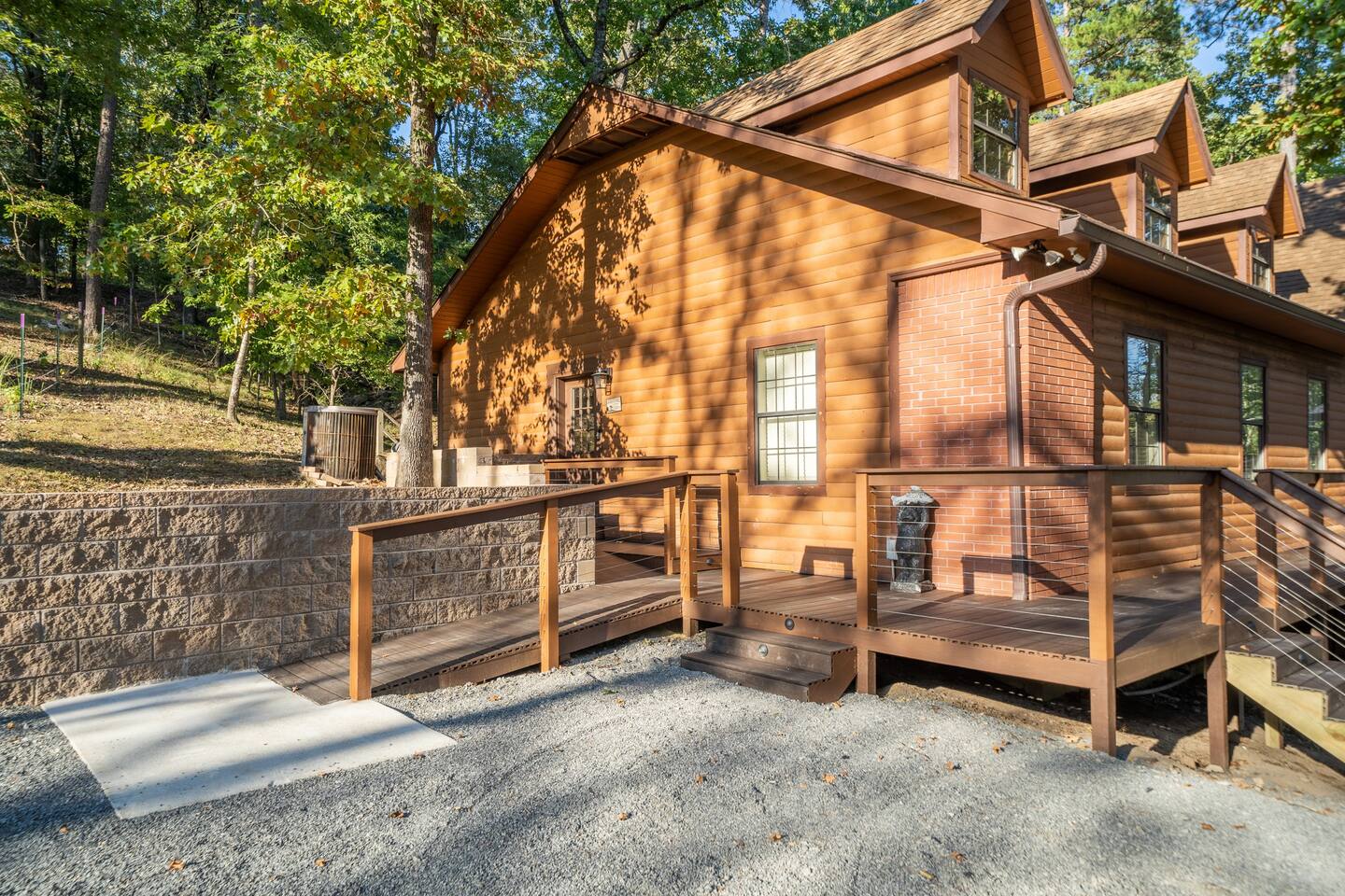 Upper parking area includes ADA Compliant wheelchair access ramps to enter the house from side and front doors.