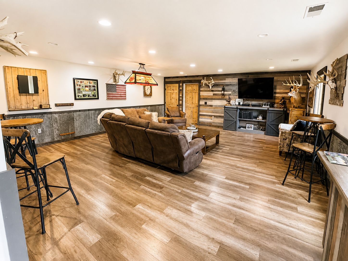 Back inside, step into the inviting living room just off the kitchen. The open, easy-flow layout keeps everyone connected, with plenty of space for your group to relax, gather, and enjoy time together.
