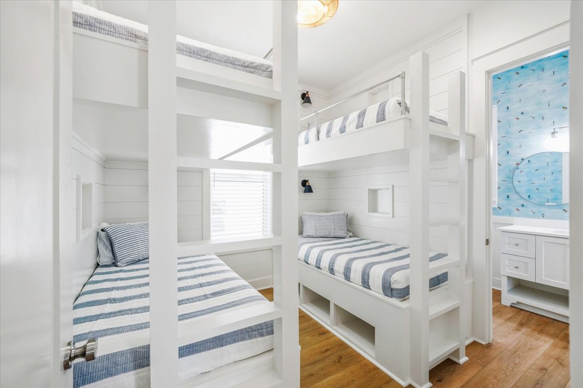 Bunk room features four built in twin beds with ladders to the top bunks.  Each bed has its only nook with power and a switch for it's individual light.