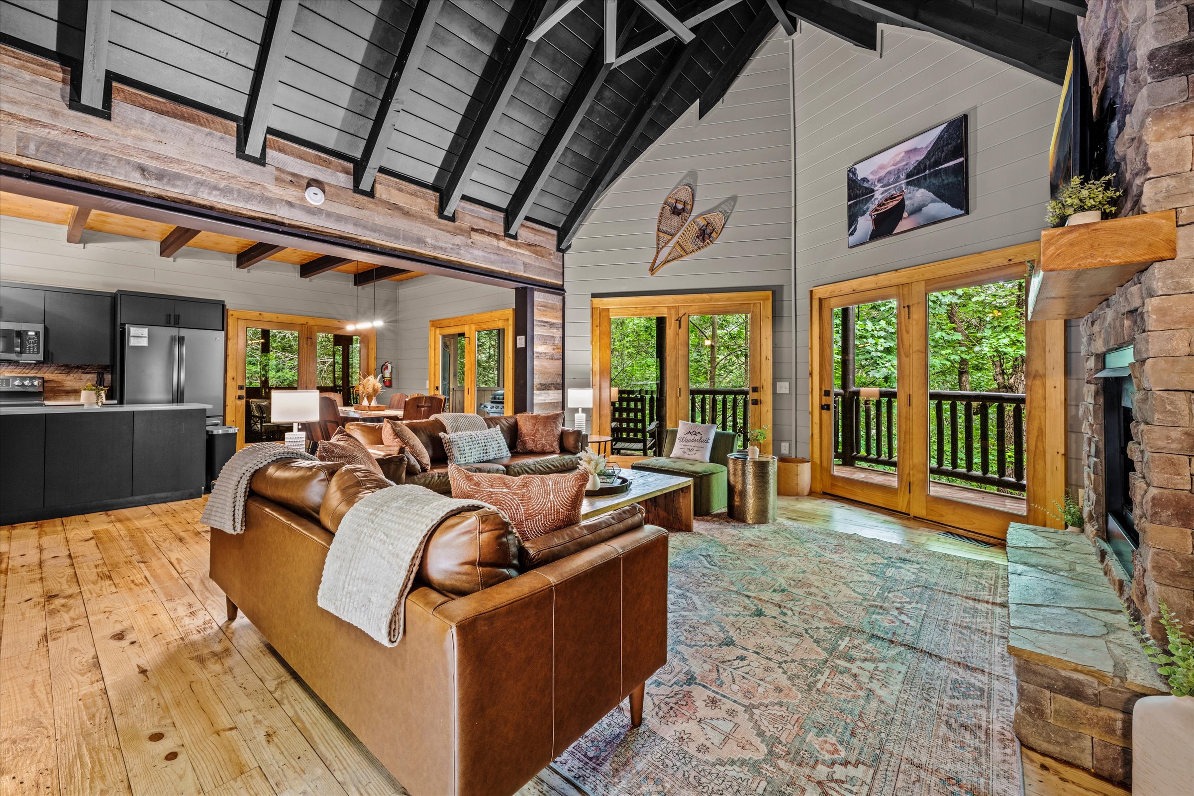 Large living area with ample seating and cathedral ceilings