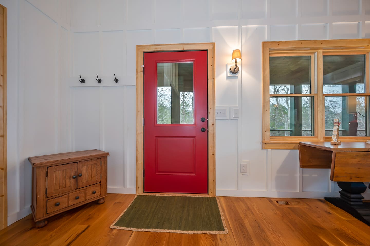 Door at dining room area leading to main level of back deck with screened in porch