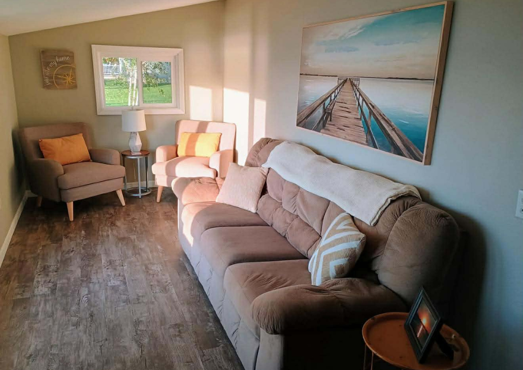 Sunroom with plenty of seating. 