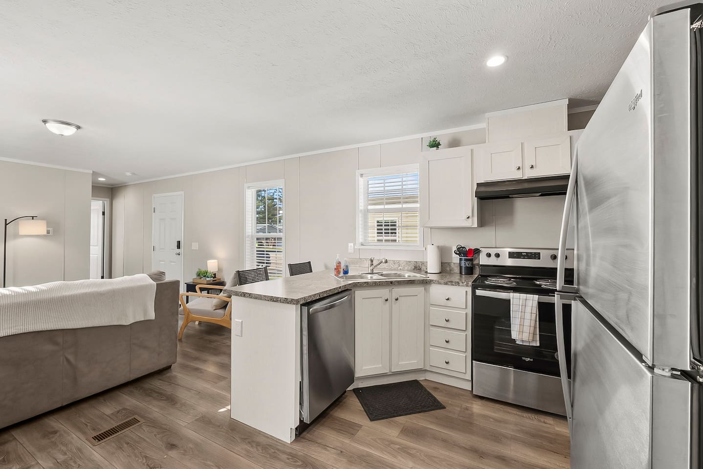Open-concept kitchen connected to the living area—great for easy cooking and staying connected with family or friends.