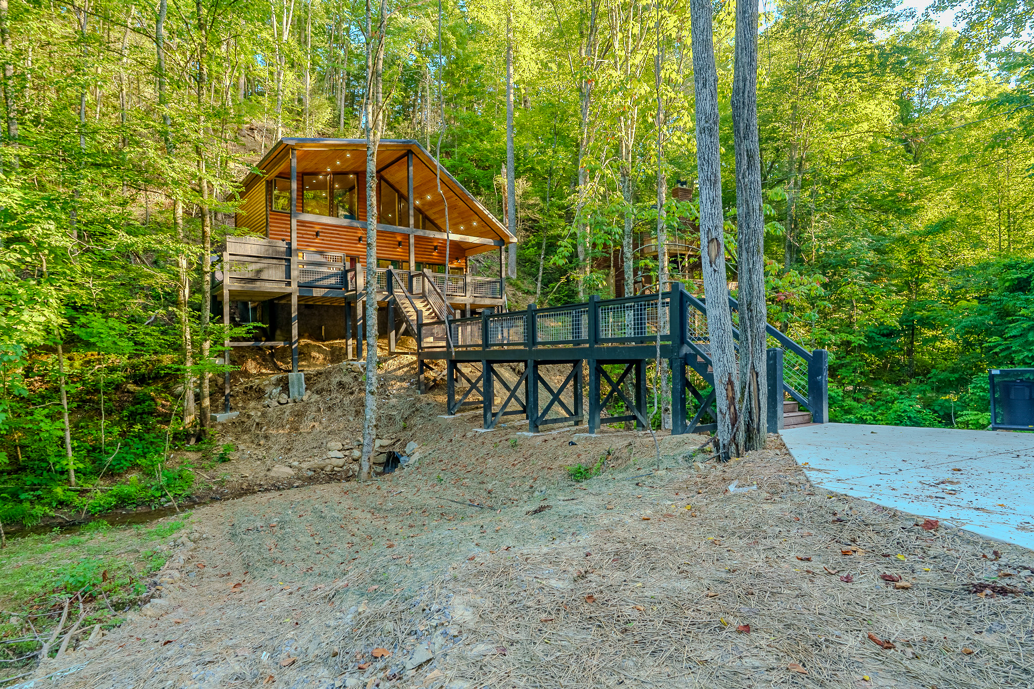 Cross the private bridge and discover your peaceful Smoky Mountain getaway