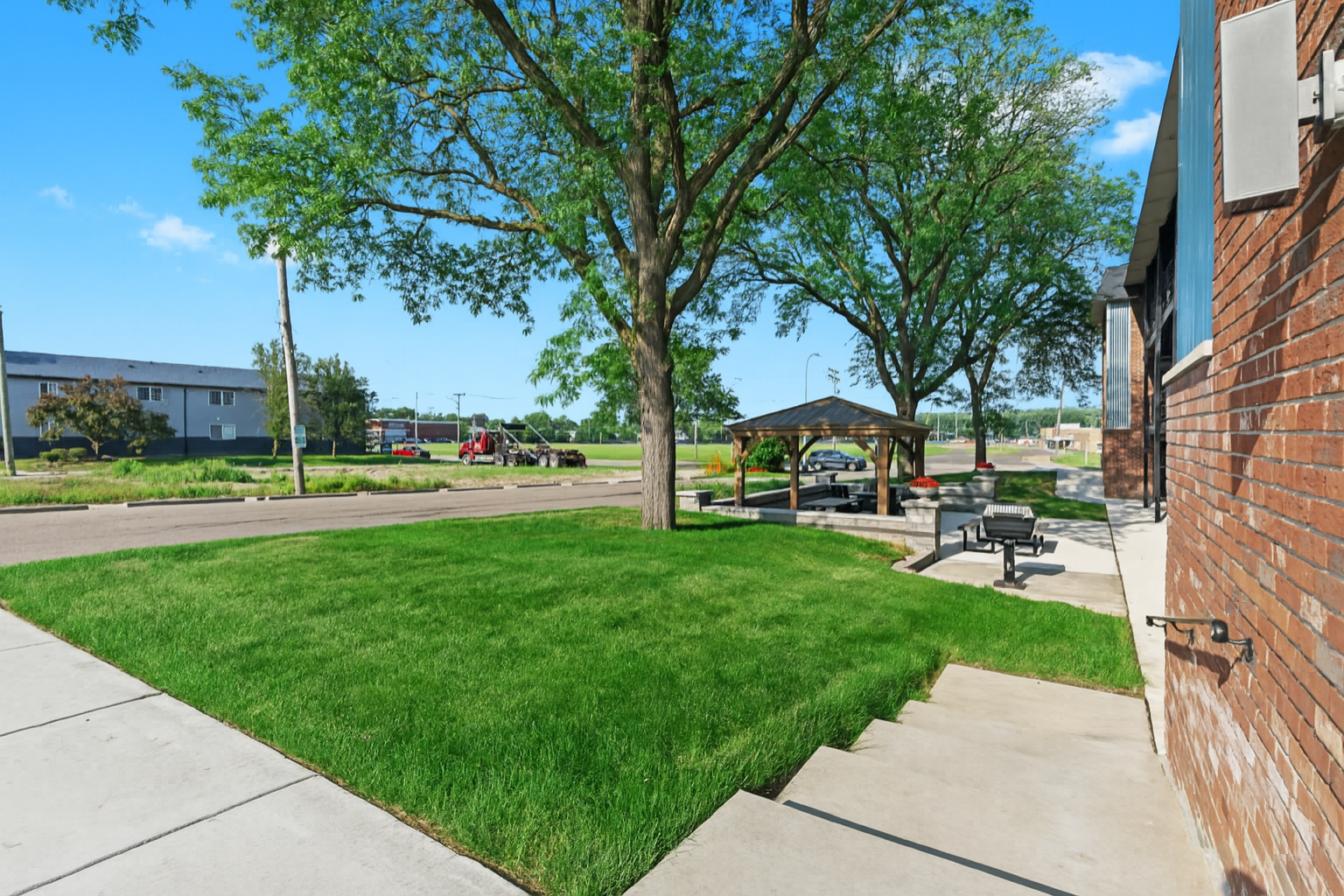 Grassy courtyard with space to walk, relax, or enjoy a breath of fresh air.