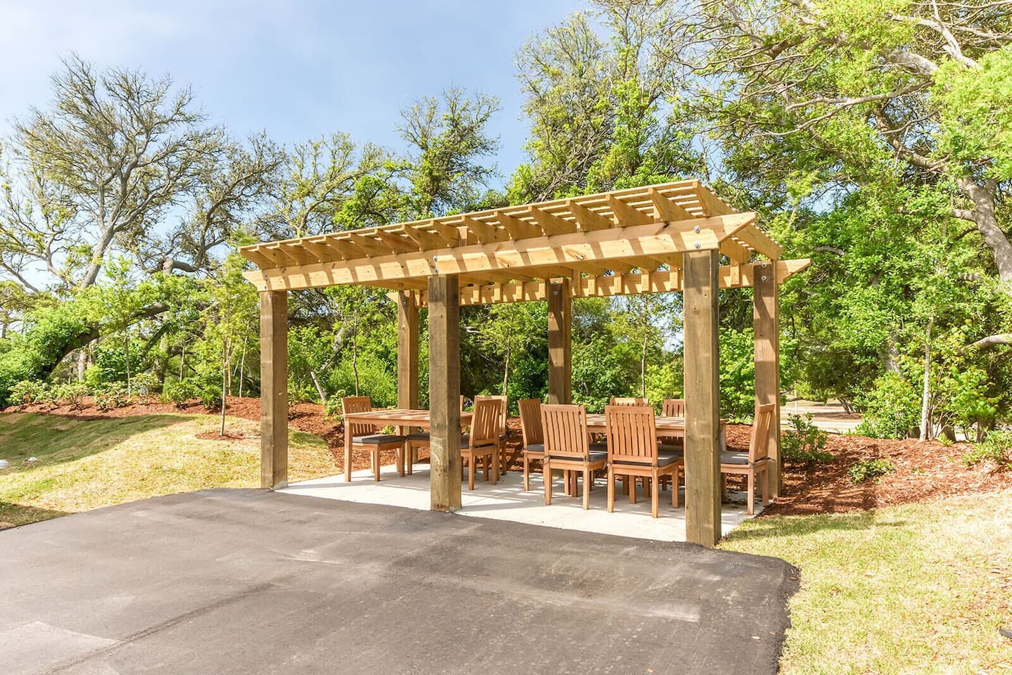 Outdoor dining under pergola — perfect for group meals