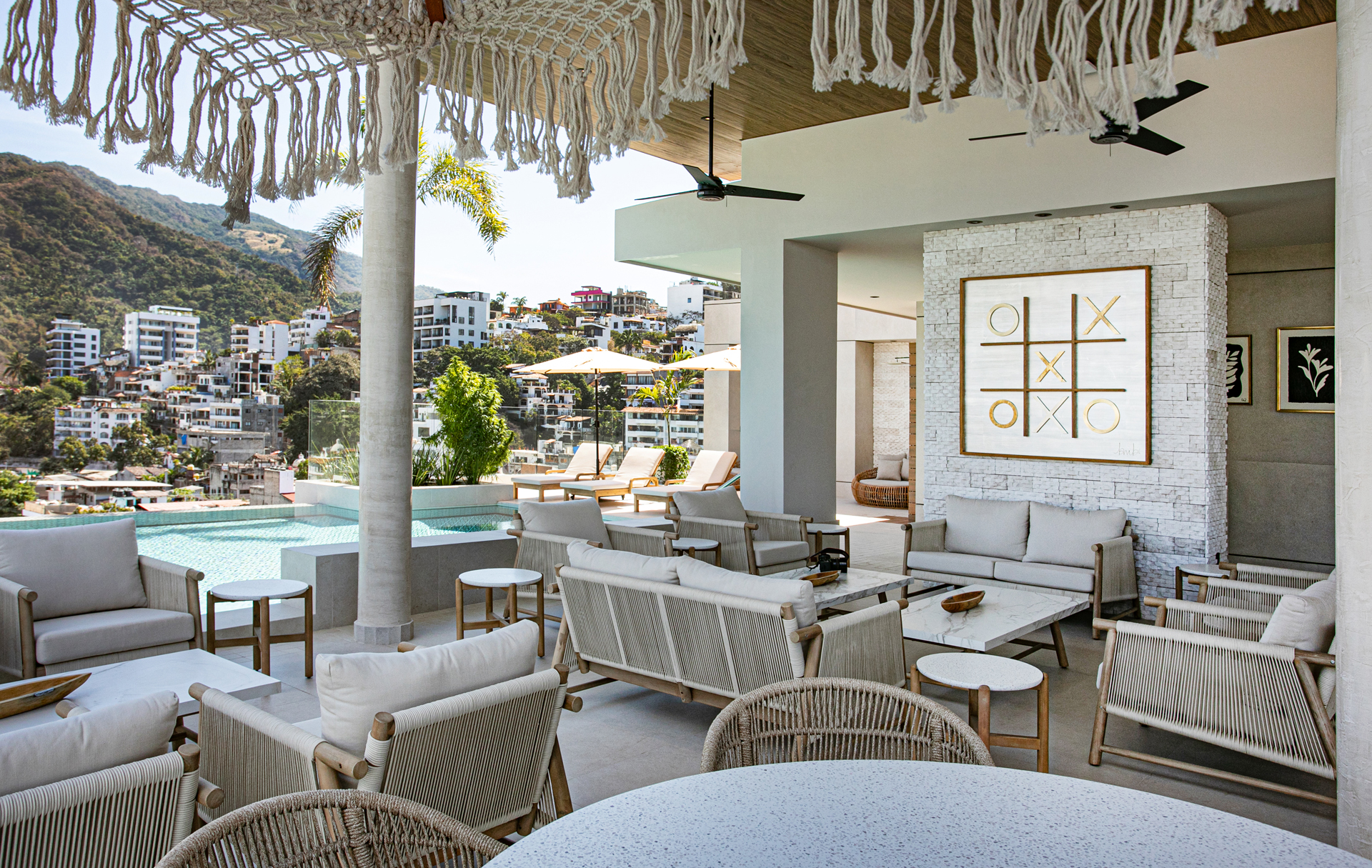 The rooftop offers plenty of comfortable seating areas—ideal for conversations, remote work, or simply enjoying the ocean breeze.