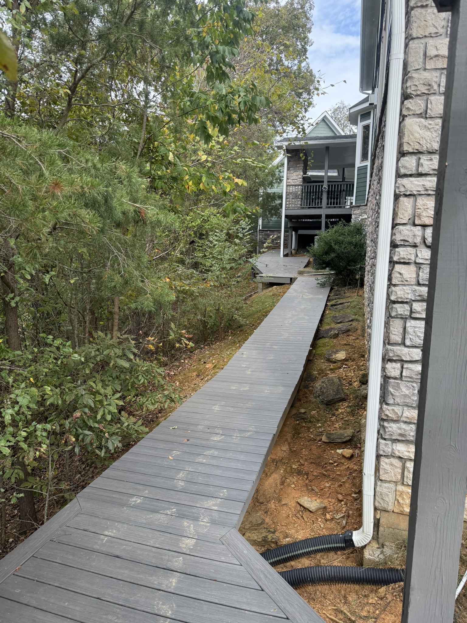 View from back of home looking at grill deck attached to front porch