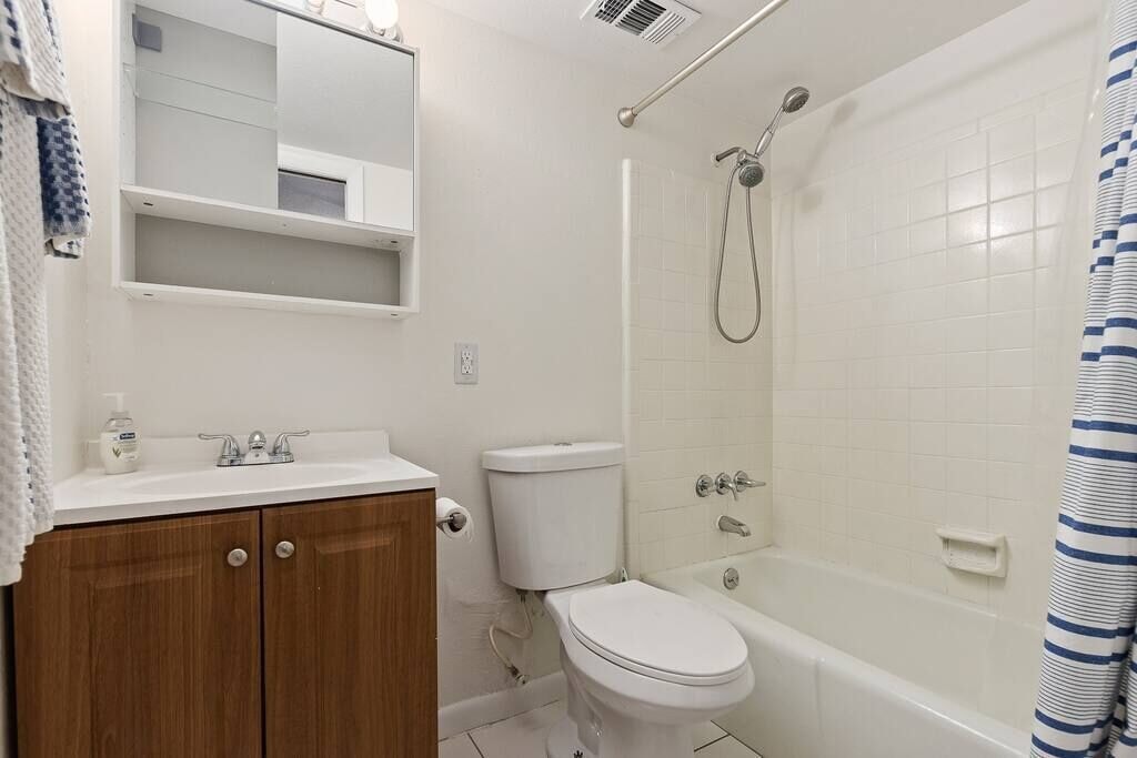 Downstairs bathroom attached to bedroom.