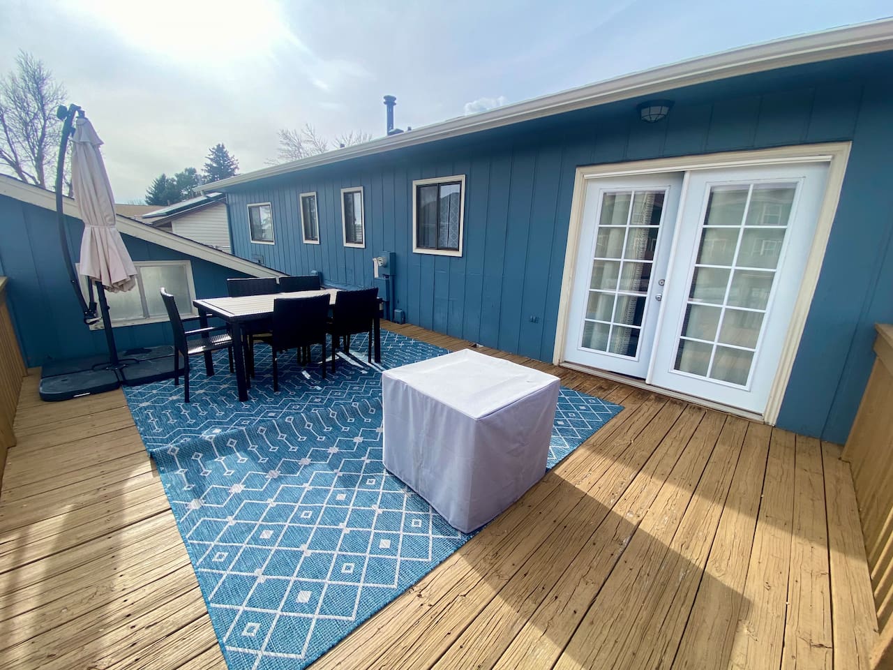 Private patio with fire pit, table and grill