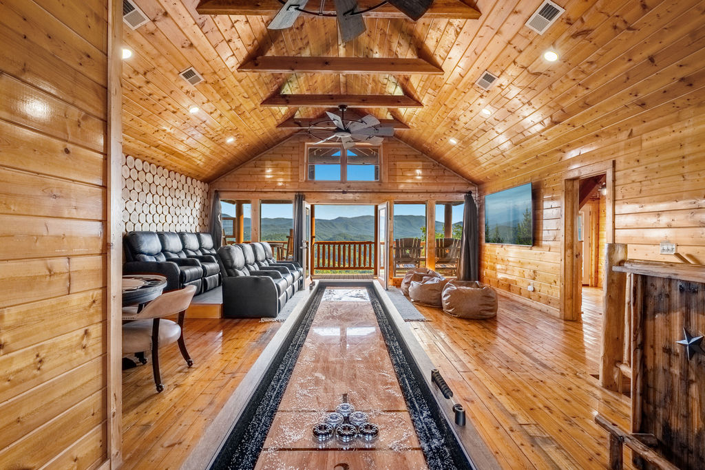 Challenge your crew to shuffleboard or poker by day, then wind down in the theater room by night&mdash;all with a screen-worthy, panoramic Smoky Mountain backdrop.