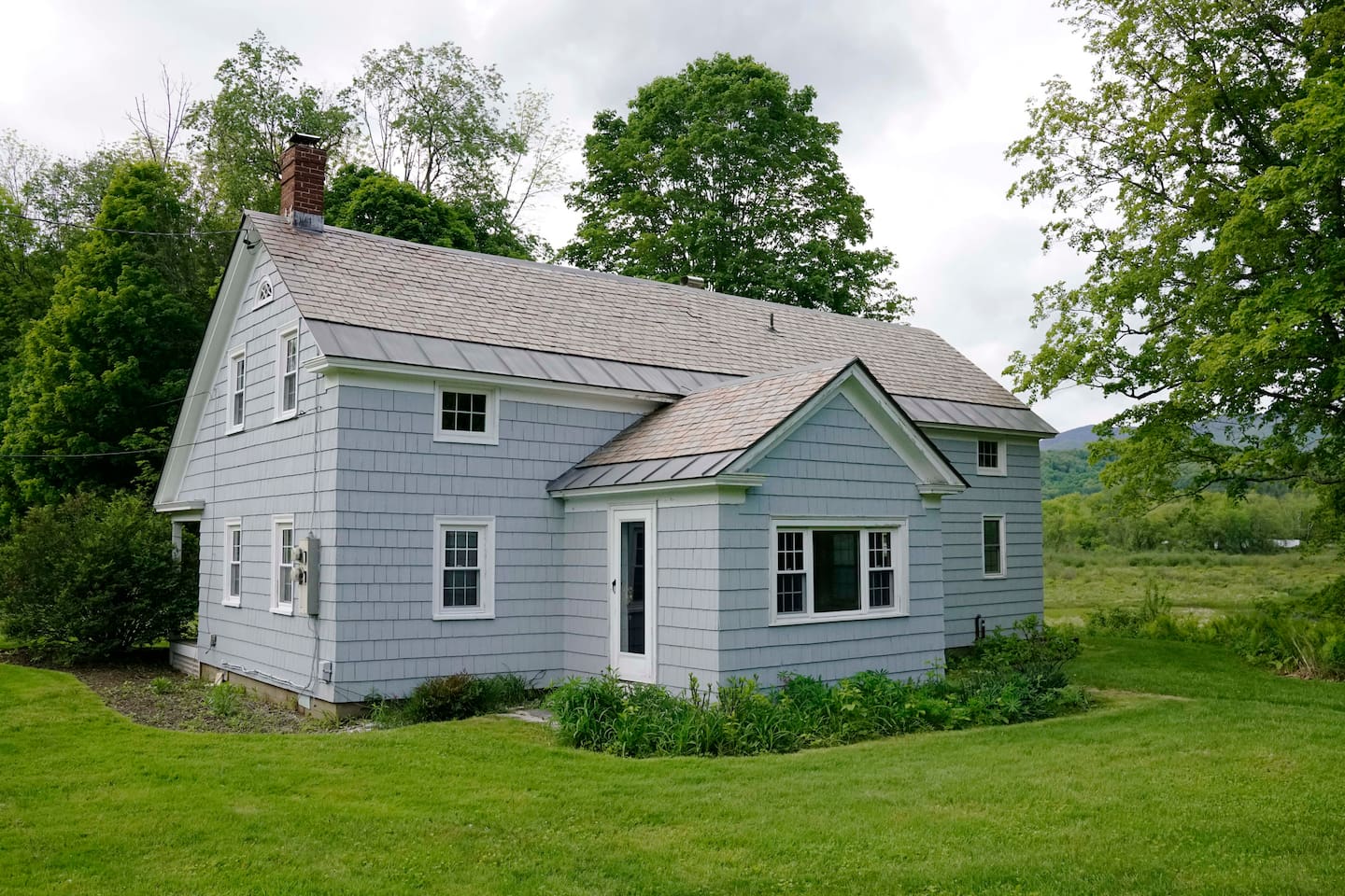 Home located in a beautiful setting across the street from the marble Mansion 