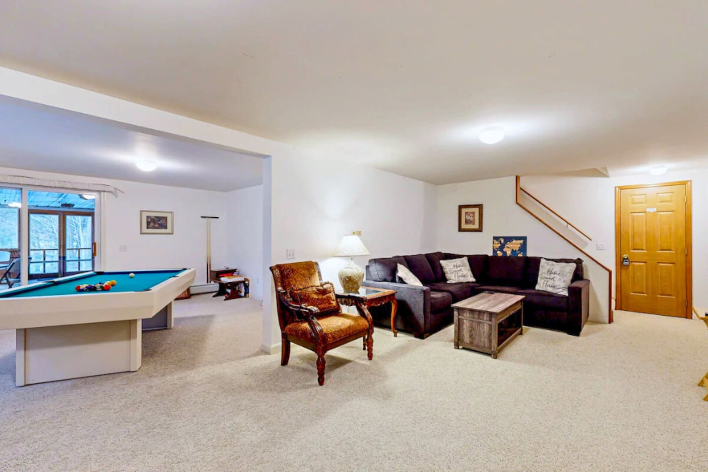 Wonderful second living room / game room in the basement with pool table, board games!