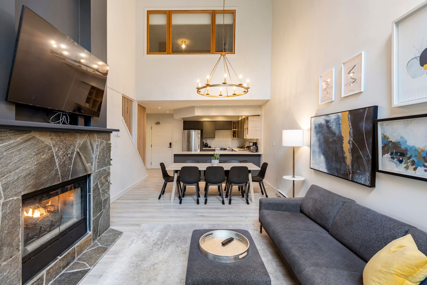 Open concept living, dining and kitchen The lofted 18' ceiling makes it feel open and spacious. The window is in the upstairs bedroom that has an ensuite powder room.
