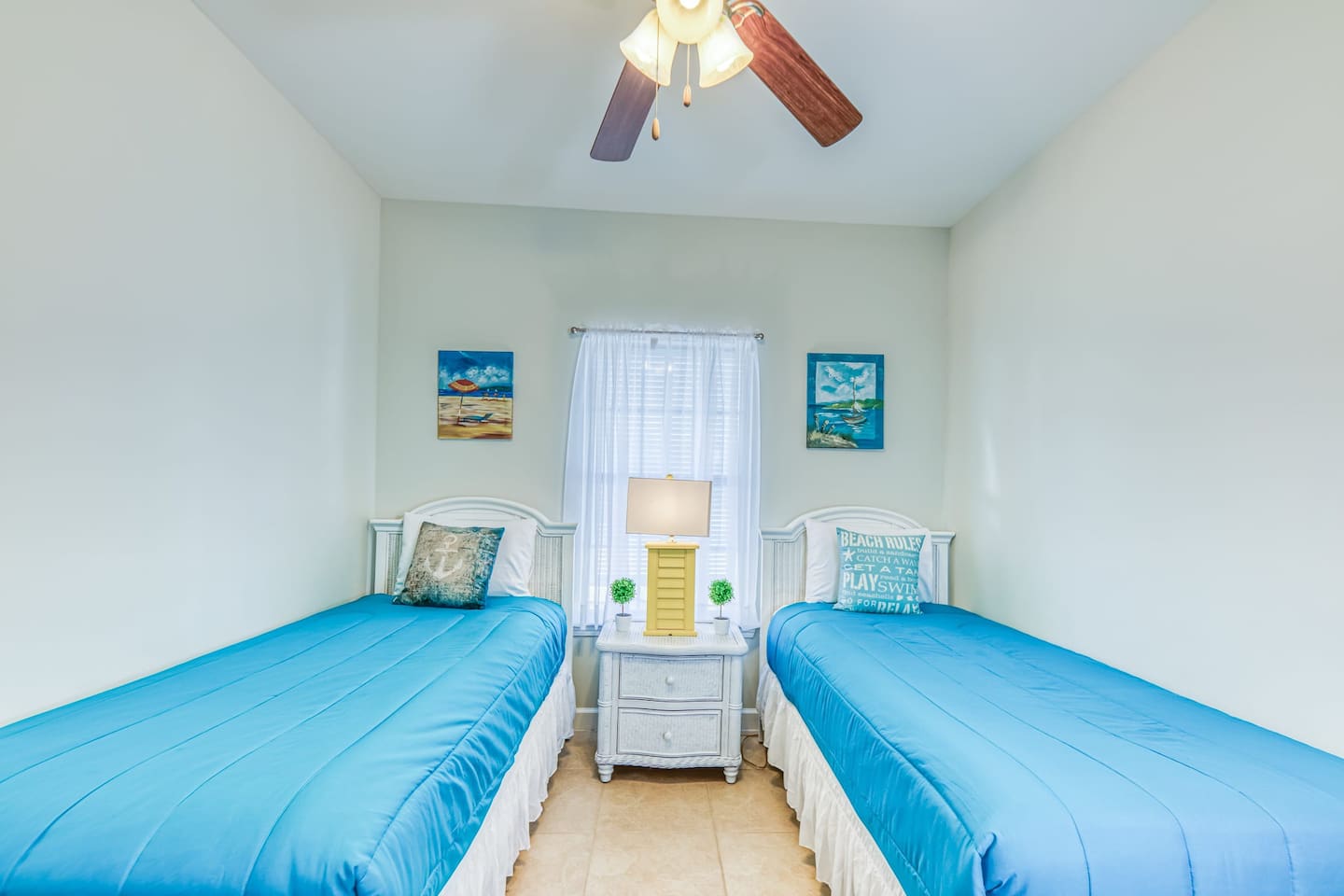Kid's Retreat: Bright twin beds with beachy decor create a fun, inviting space for young guests!