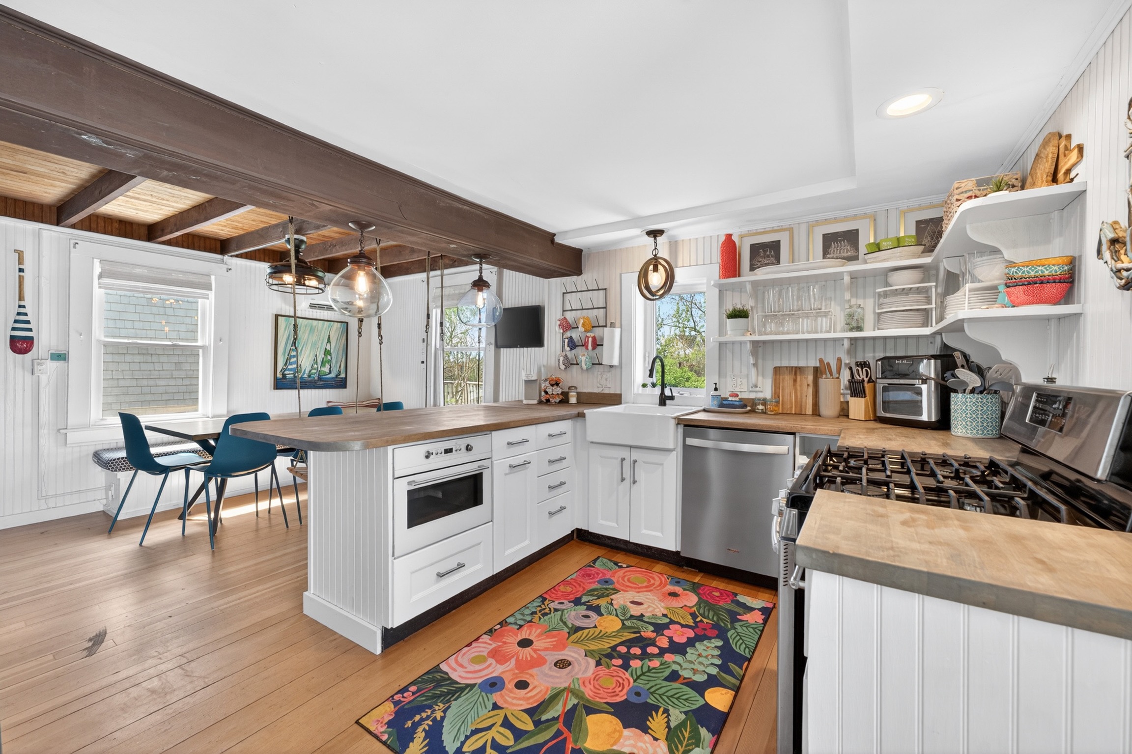Fun and bright, this fully stocked kitchen has everything you need to prepare and enjoy meals at home.