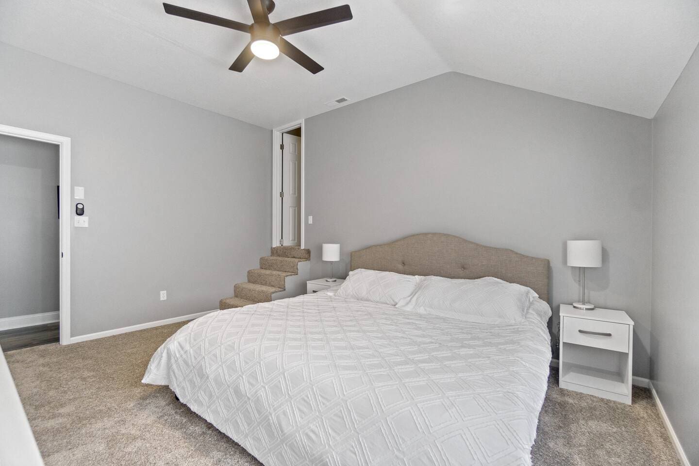 Spacious and comfy bedroom view, offering a relaxing atmosphere with ample space and a cozy, inviting design.