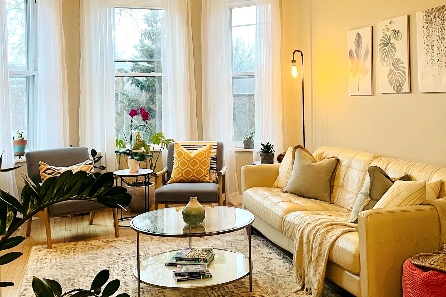 Open living space filled with natural light and cozy seating.