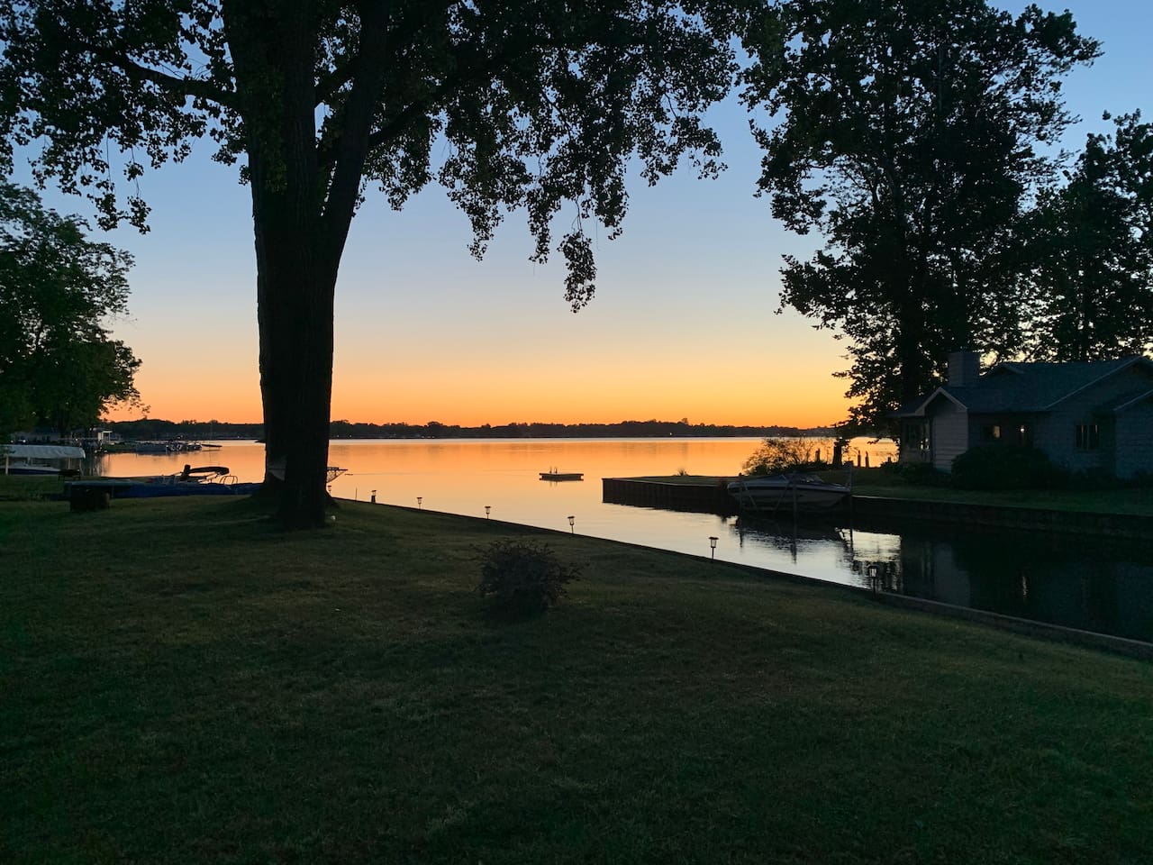 Beautiful Paw Paw Lake sunset just steps from the property.