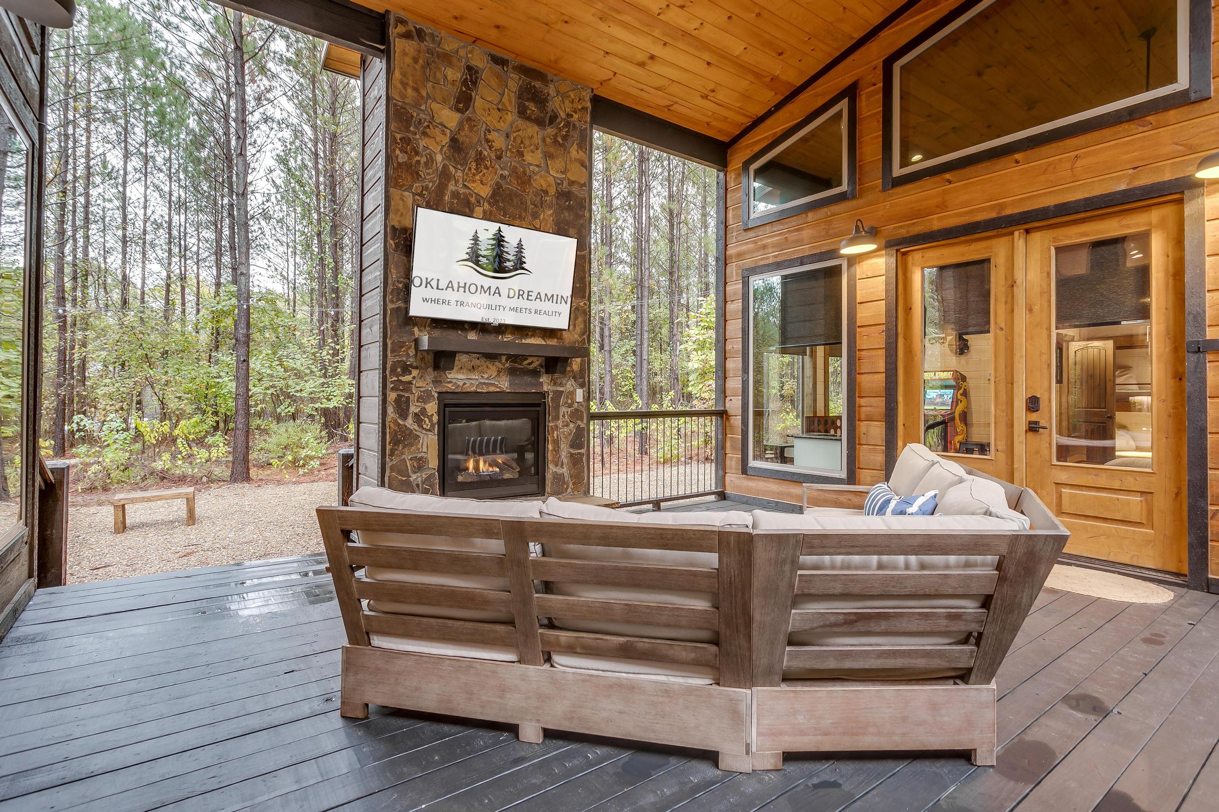 Covered patio for lounging in any weather conditions with gas fireplace and smart TV