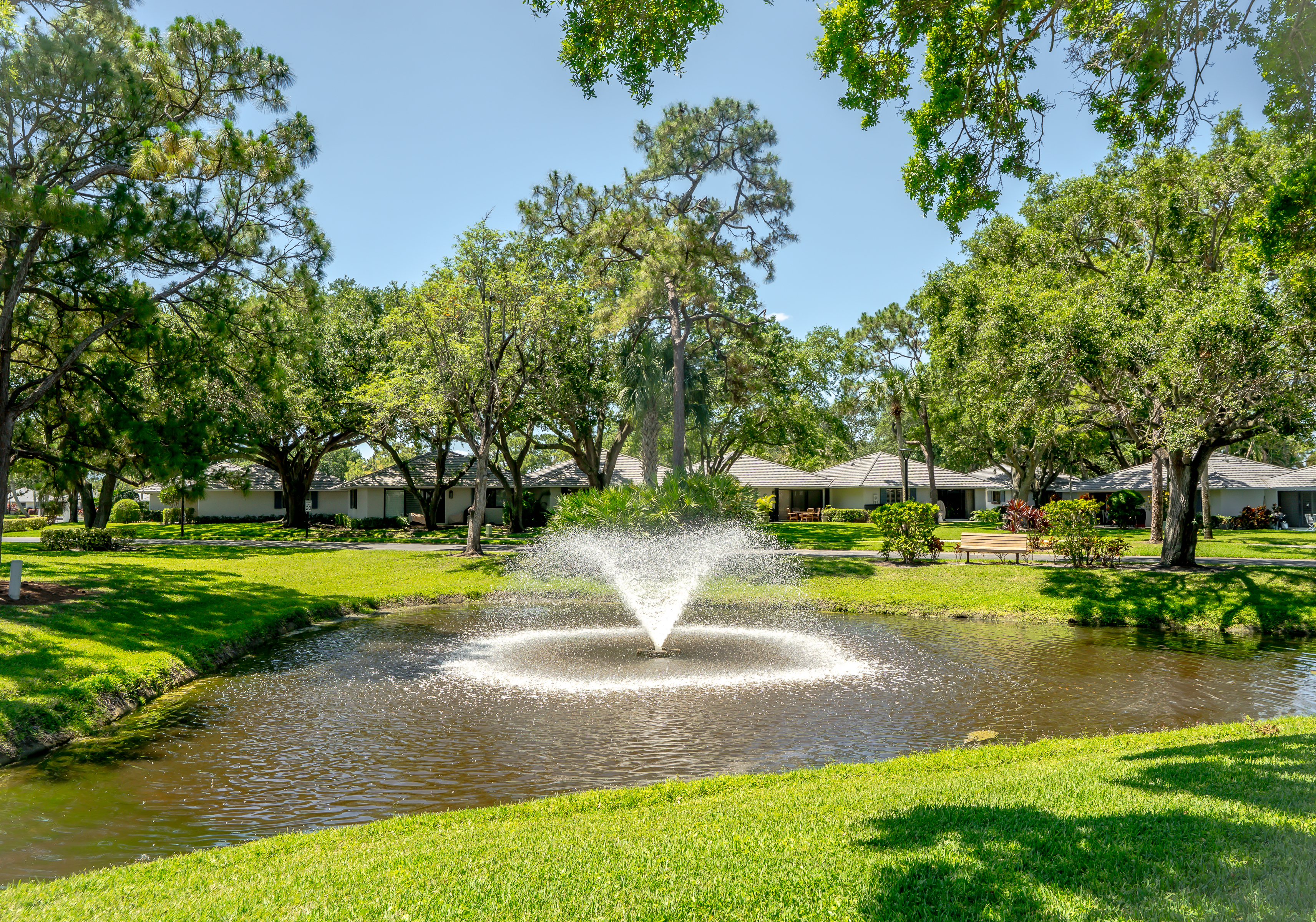 Peaceful lakefront setting with lush tropical landscaping, walking paths, and tranquil fountain views right outside your door.
