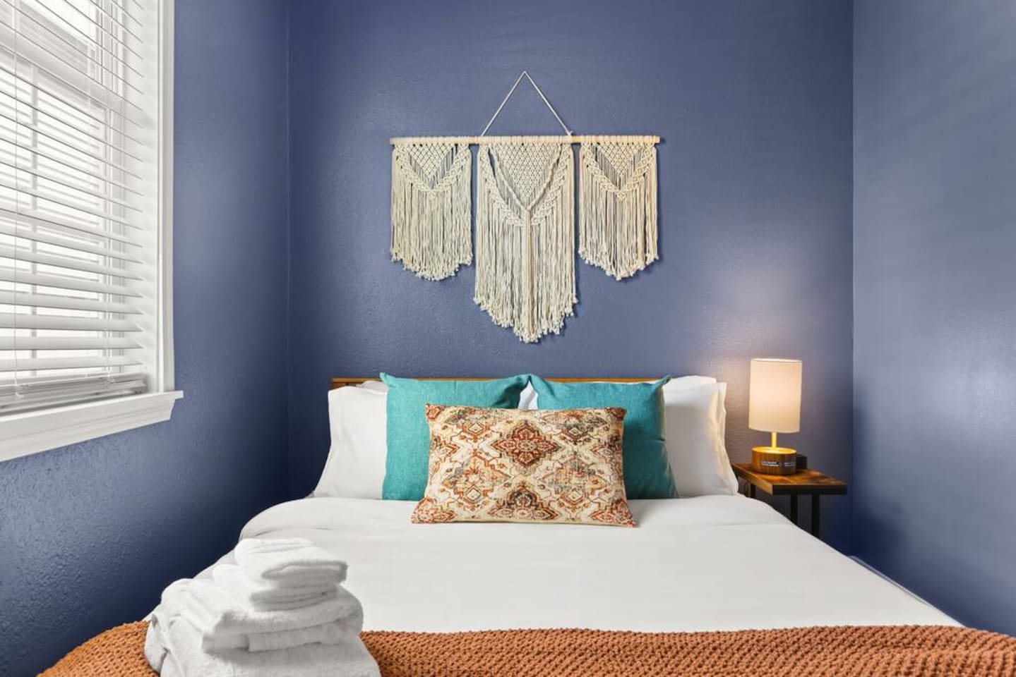 Unwind in the Blue Room, equipped with a memory foam mattresses queen bed, closet, and ceiling fan. 