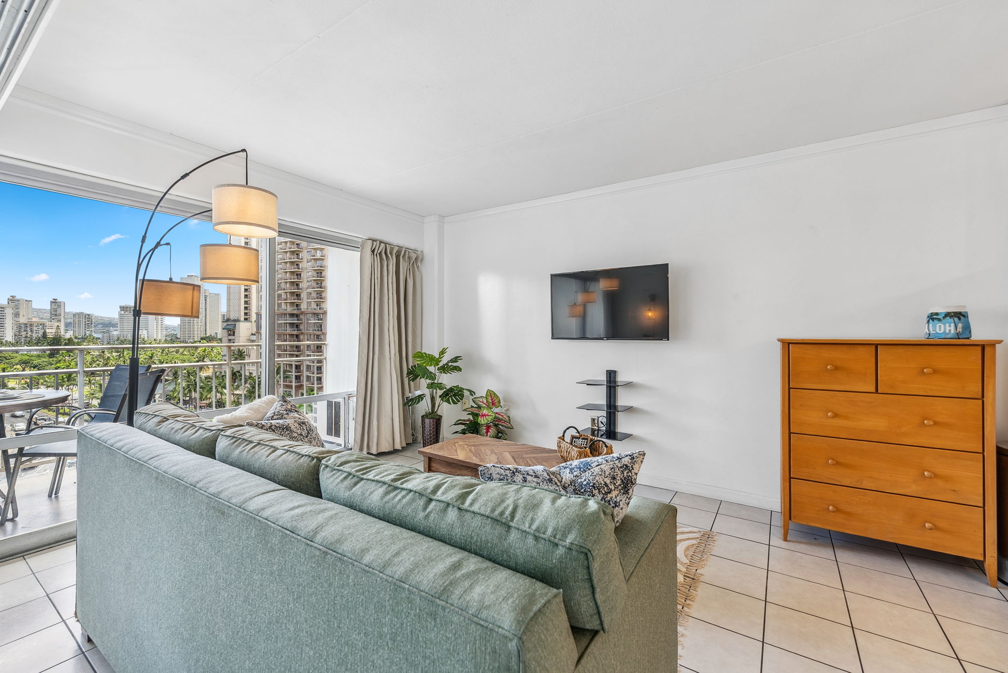 Living area adjacent to main bedroom with open floor plan