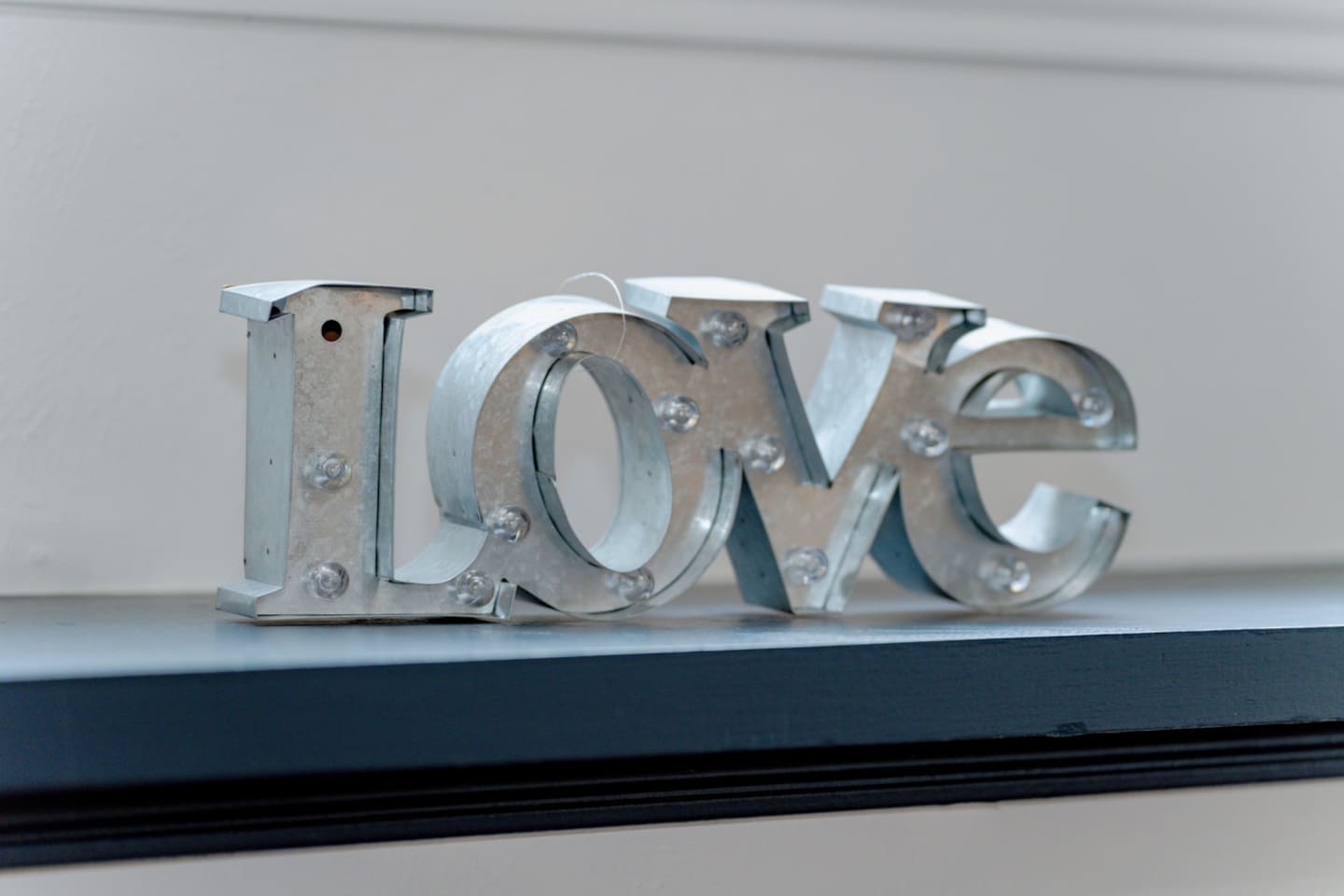 Statement “LOVE” decor piece adding character to the space.