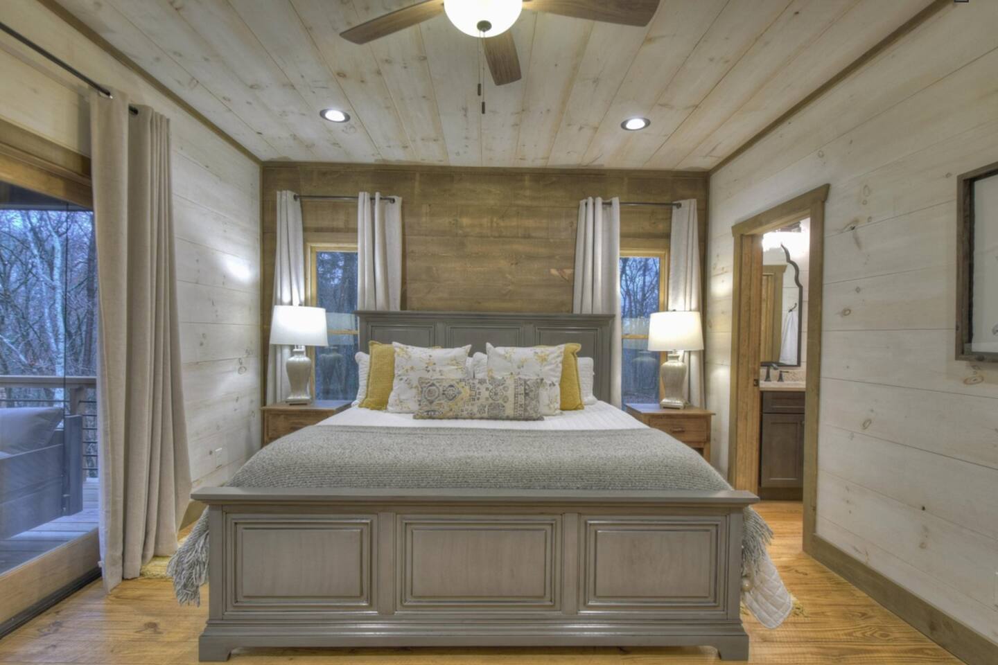 Master Bedroom, main floor, door to deck, king bed.  TV in room
