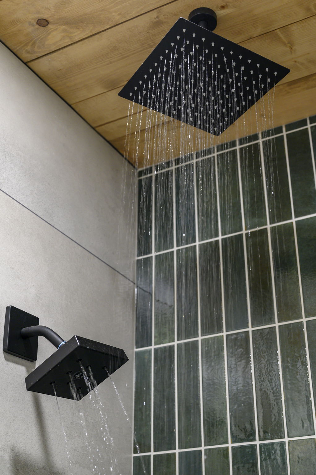 Bunk room walk in shower with rain shower head 