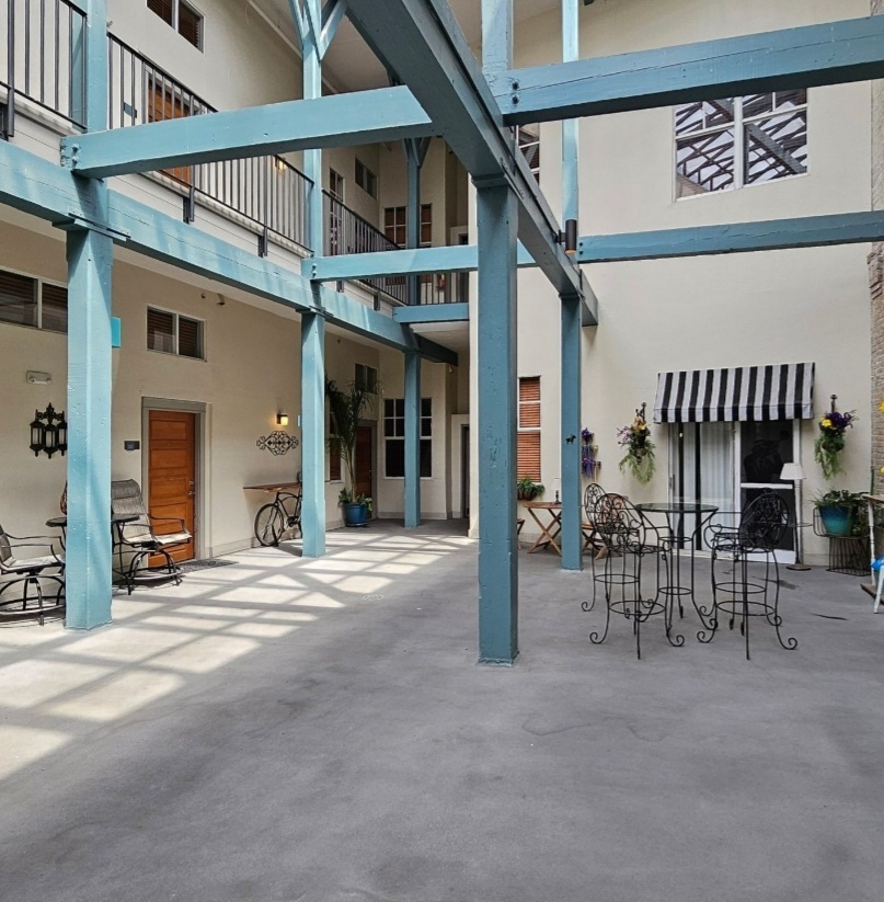 Atrium view of our patio - following the striped awning!