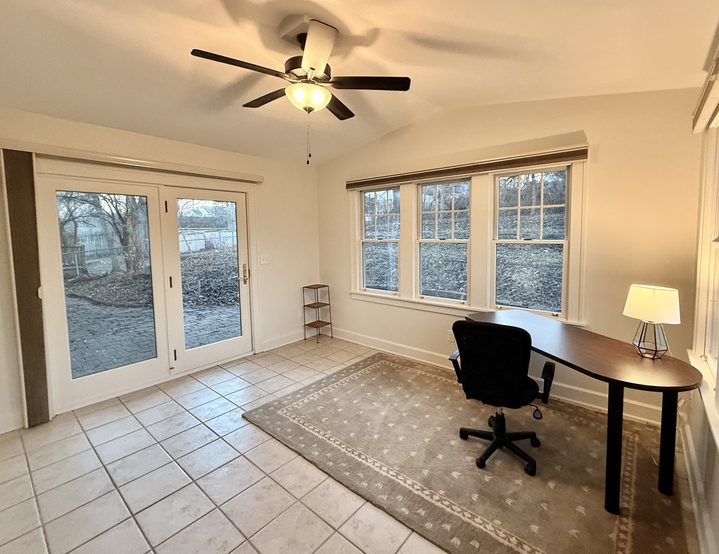 Dedicated office in a beautiful 4-season sunroom with an egress door for your afternoon breaks.