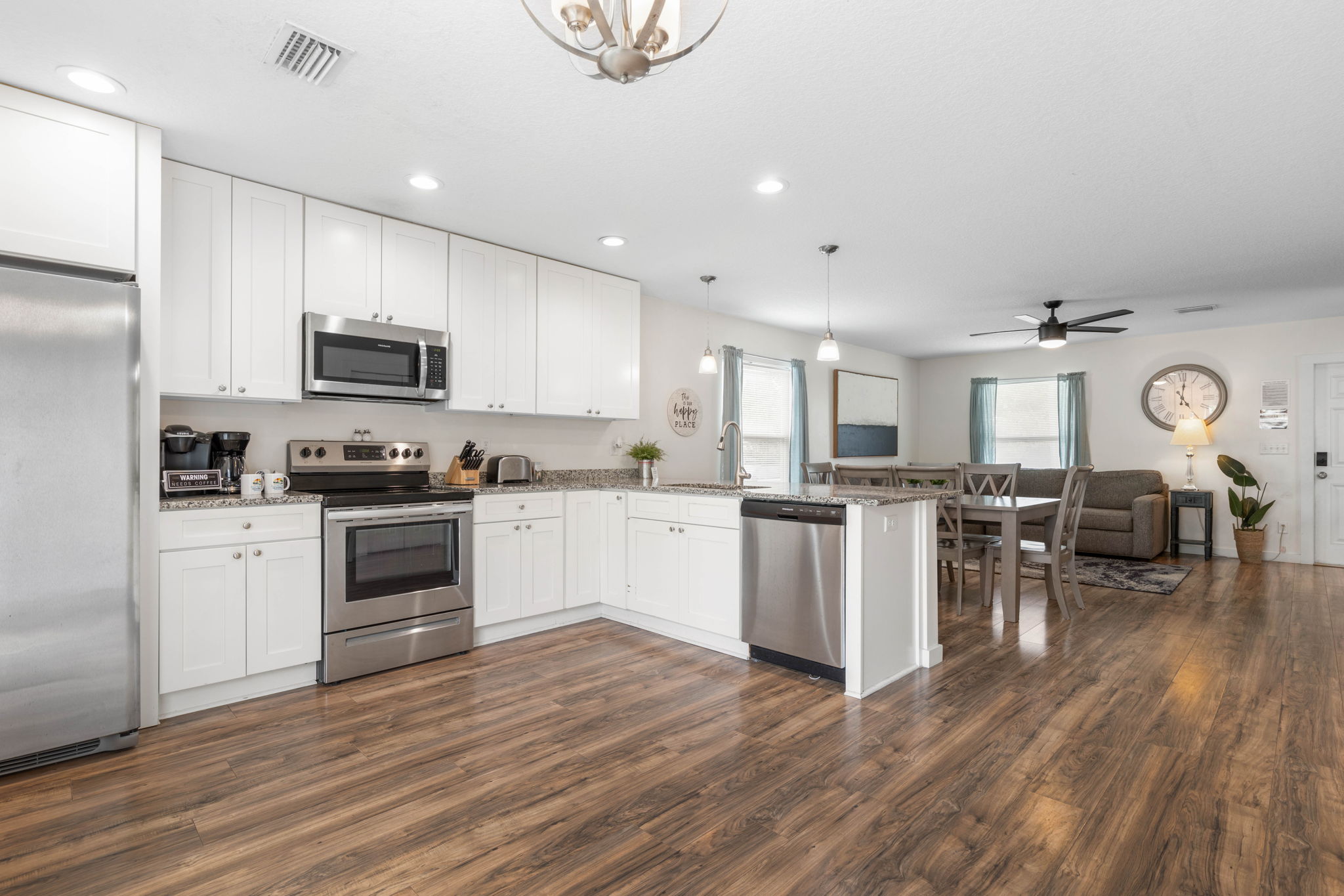 Start the morning with coffee in the kitchen, gather for dinner after the beach, and let the whole house stay connected—this bright open layout keeps the laughter, snacks, and vacation stories flowing all day long.