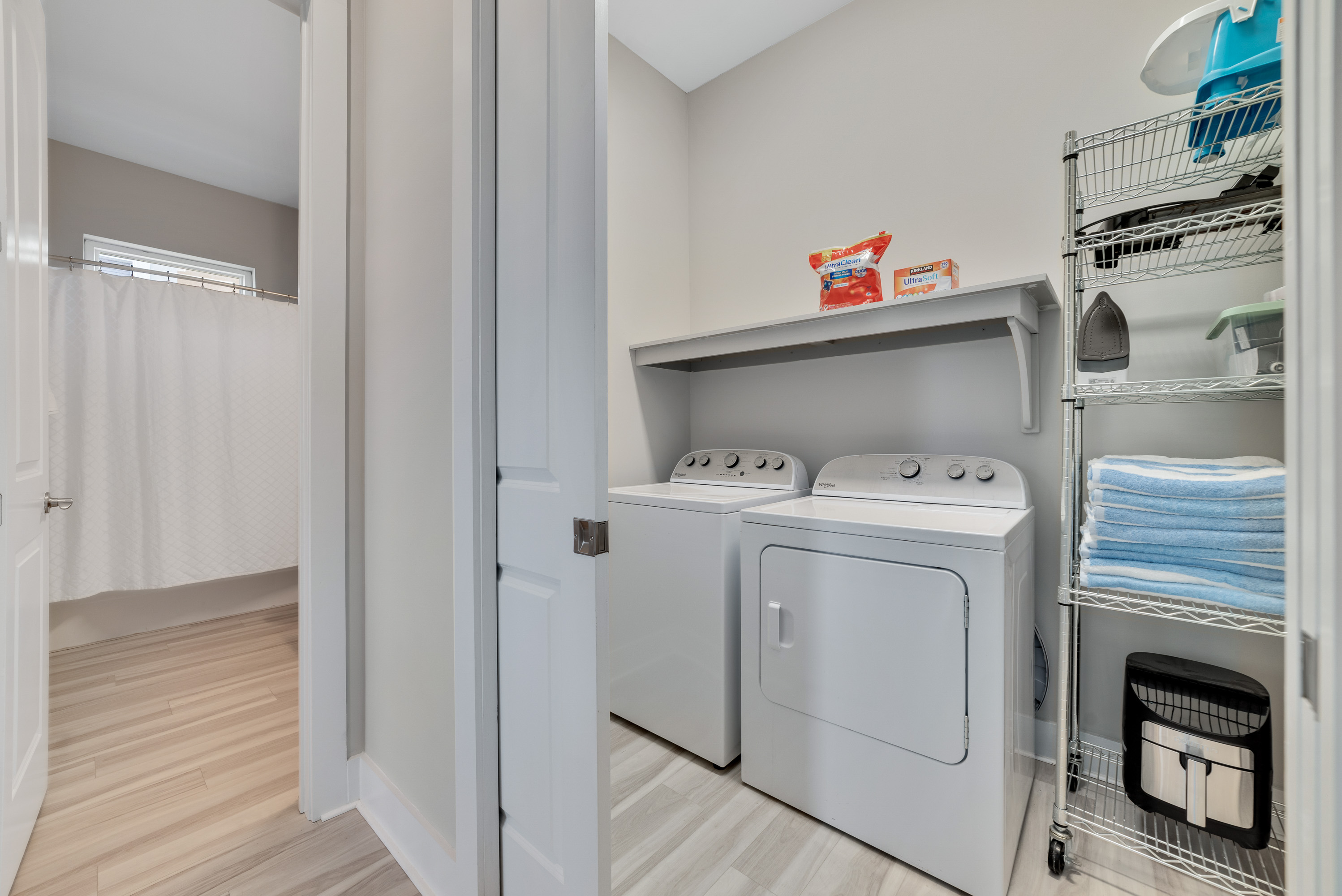 Laundry room with full size washer and dryer.  Iron and beach towels.