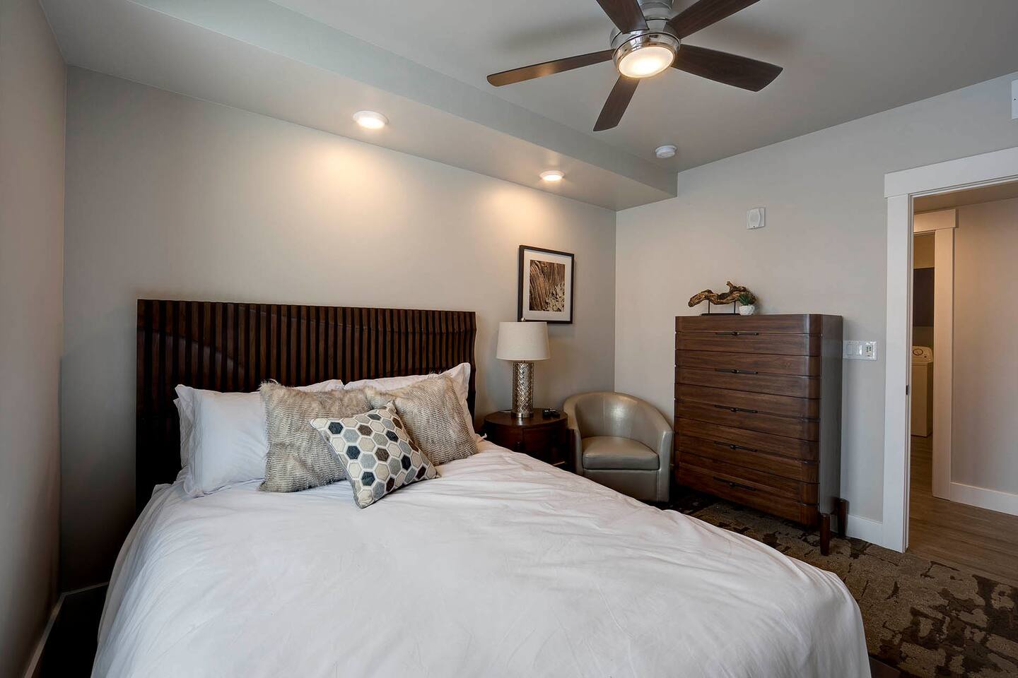 The charming second bedroom provides a queen bed and a 43" TV.