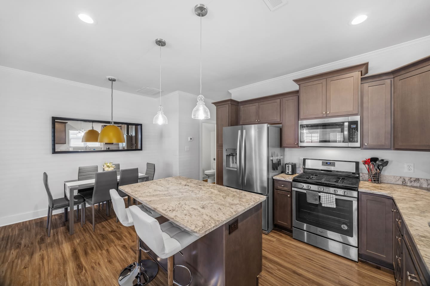 Open layout keeps the kitchen seamlessly connected to the dining and living spaces for easy entertaining.