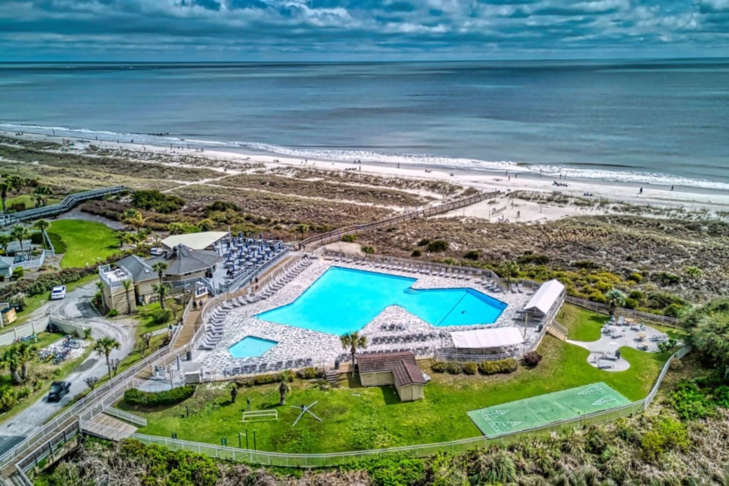 Aerial view of the resort pool and beach