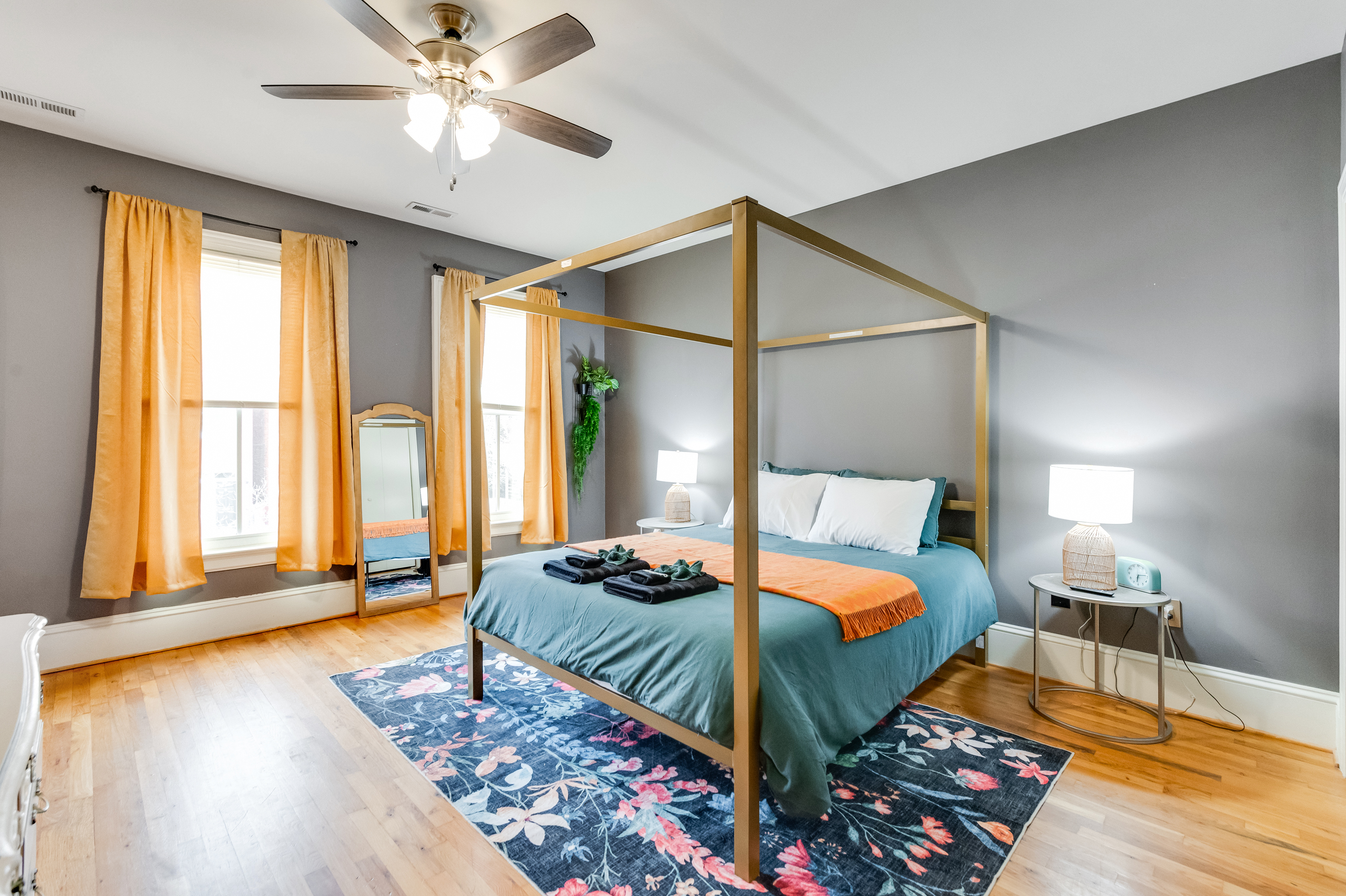 Queen Bedroom 2: Bright and airy retreat with a stylish four-poster bed and vibrant decor!
