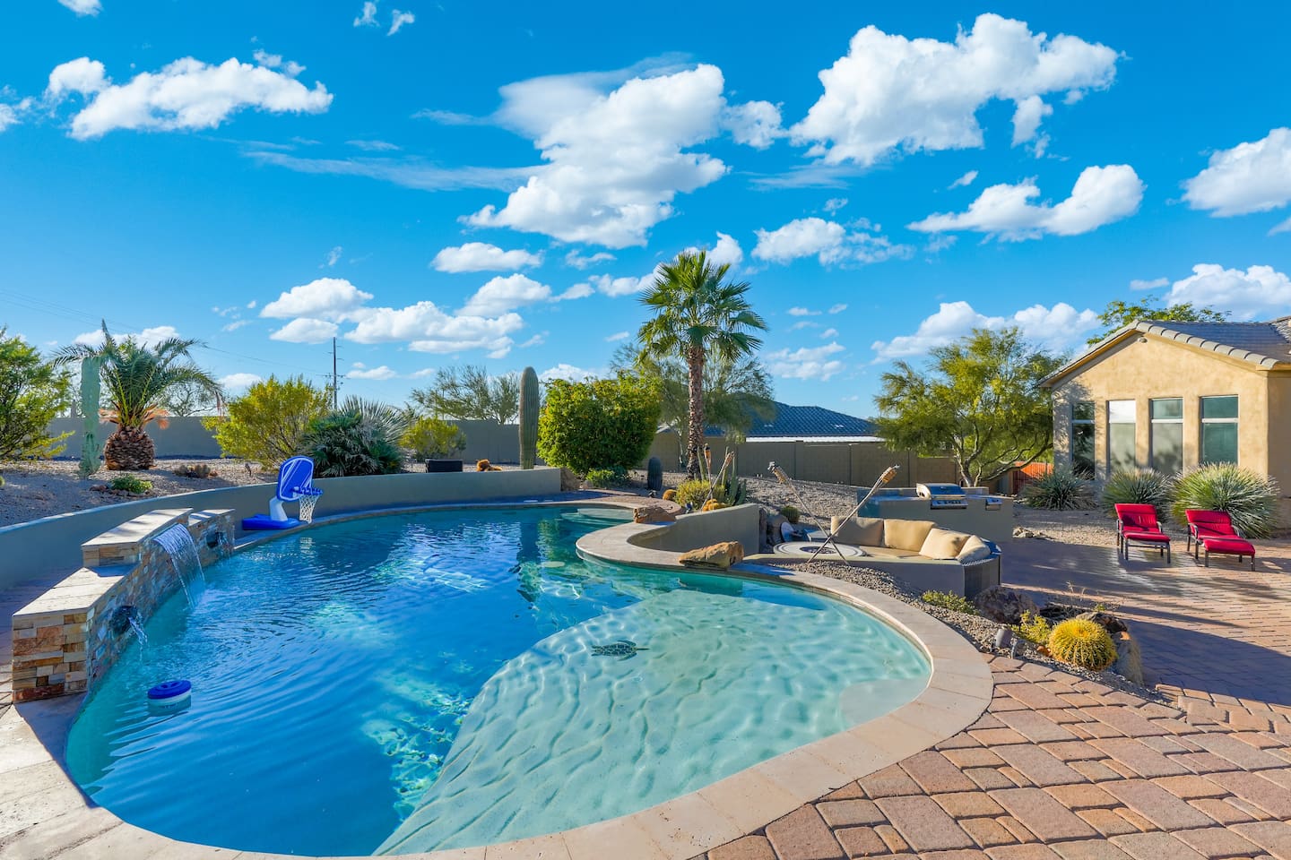Shallow sun shelf and curved pool design, perfect for lounging and relaxing in the Arizona sun.
